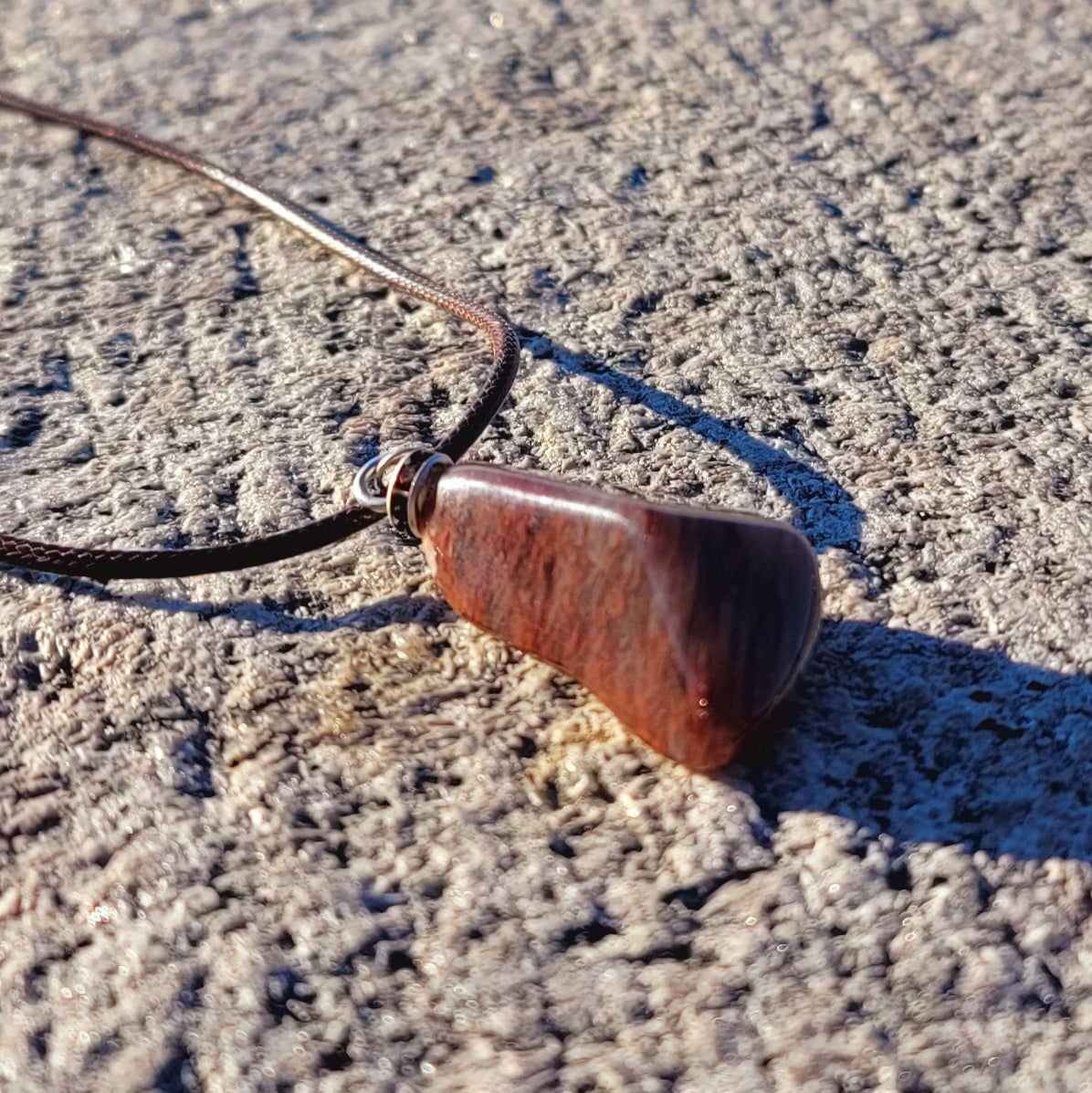 Intriguing Ferruginous Quartz Pendant. This unique piece will be a great gift for him or her this holiday season and beyond. Treat them today, or just treat yourself to it!