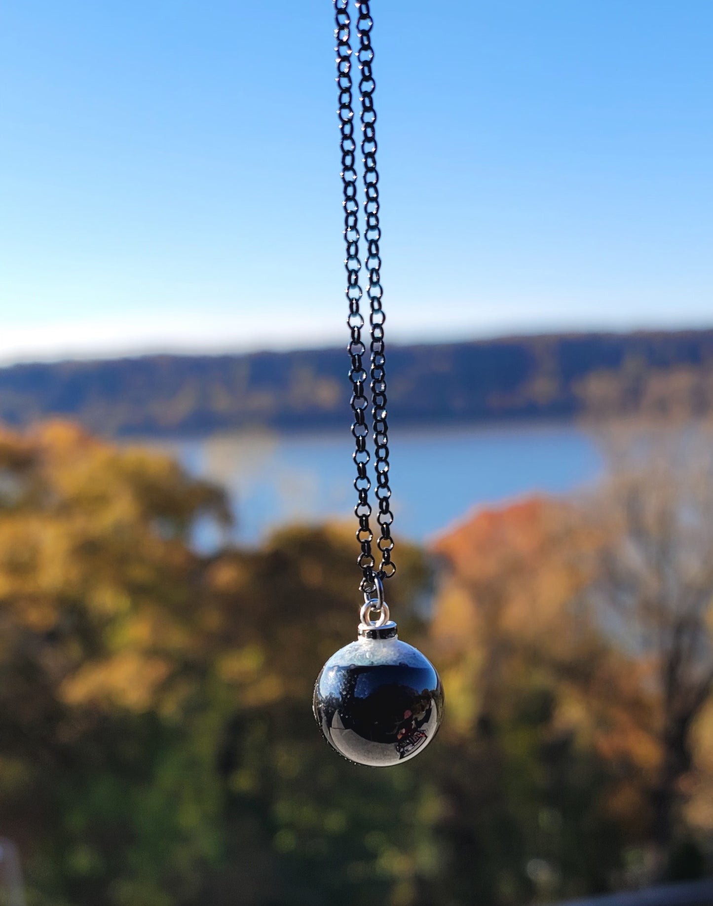 STRIKING COMBINATION BLACK AGATE WITH WHITE QUARTZ PENDANT.