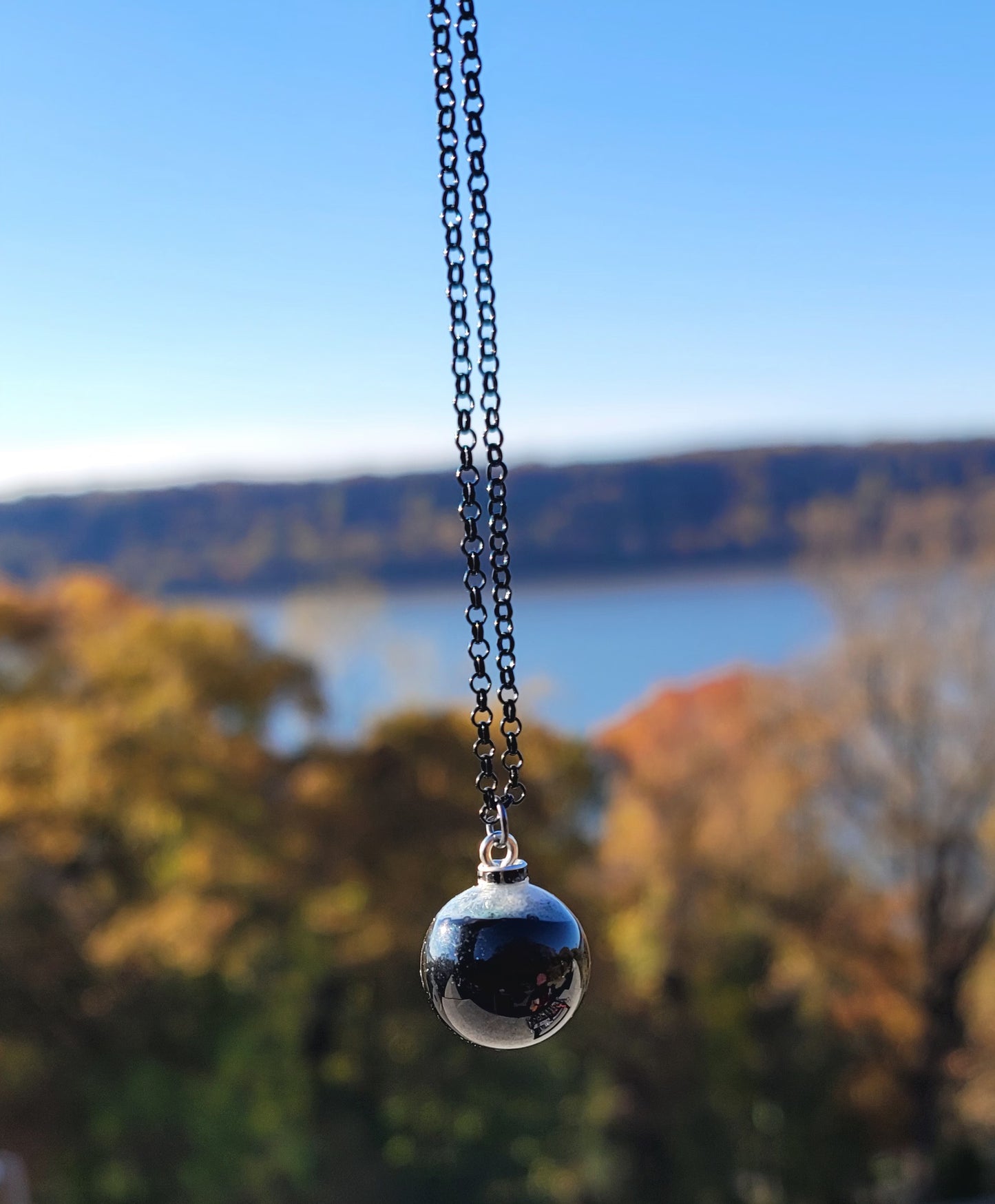 STRIKING COMBINATION BLACK AGATE WITH WHITE QUARTZ PENDANT.