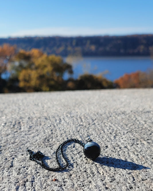 STRIKING COMBINATION BLACK AGATE WITH WHITE QUARTZ PENDANT.