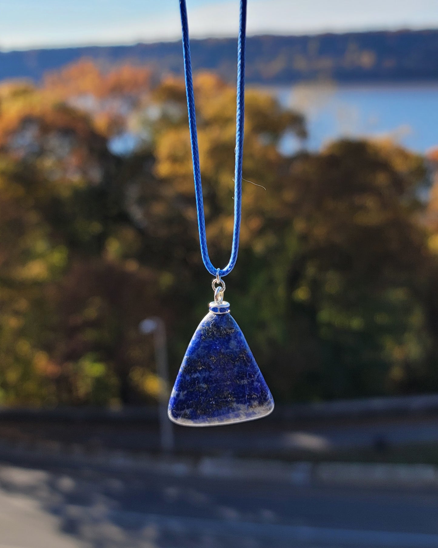 Uniquely shaped Blue Lapis lazuli Pendant necklace. Give this striking blue piece as a gift to that special person in your life. Great for mom or dad, Sis or brother. Perfect for any occasion or taste.