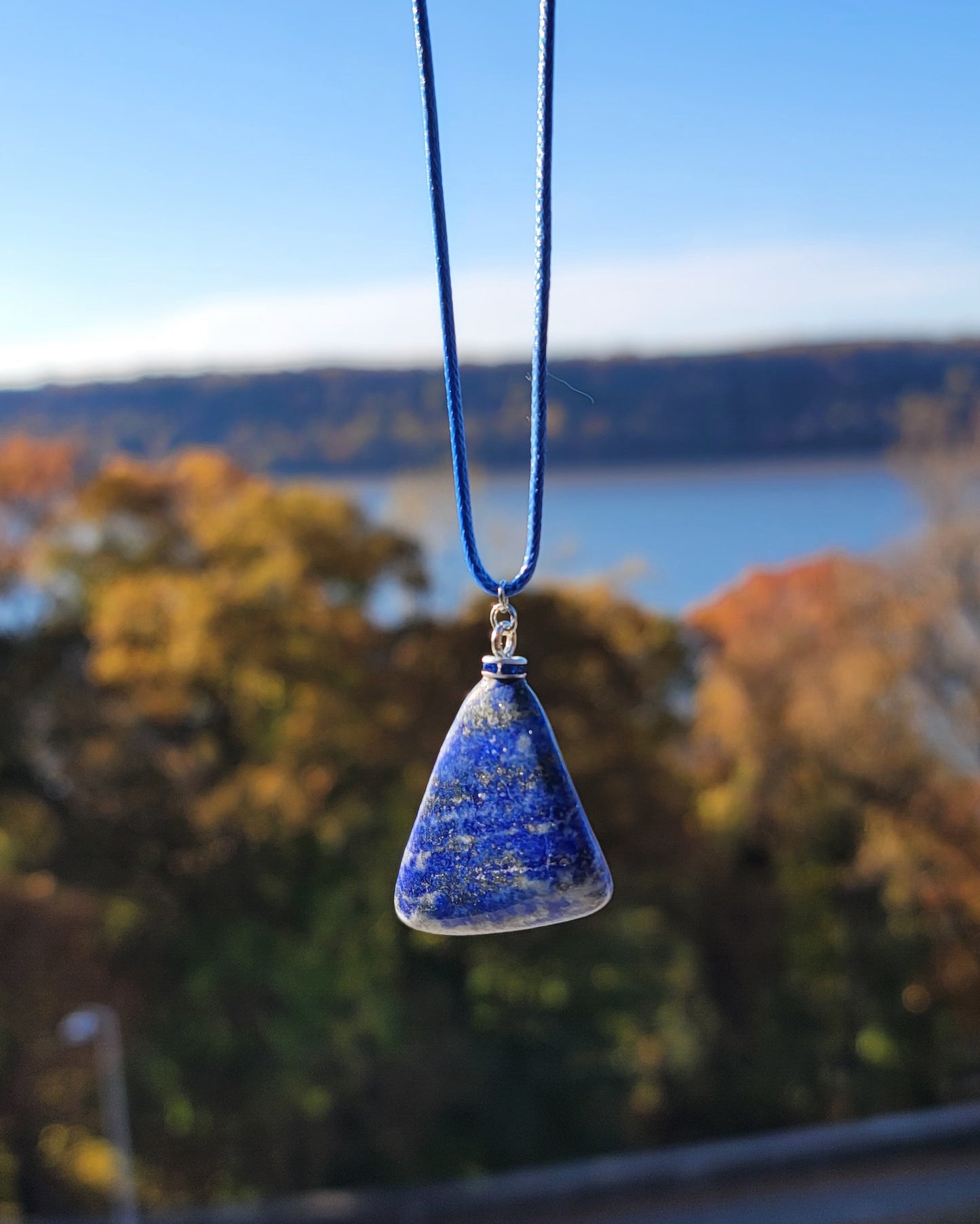 Uniquely shaped Blue Lapis lazuli Pendant necklace. Give this striking blue piece as a gift to that special person in your life. Great for mom or dad, Sis or brother. Perfect for any occasion or taste.