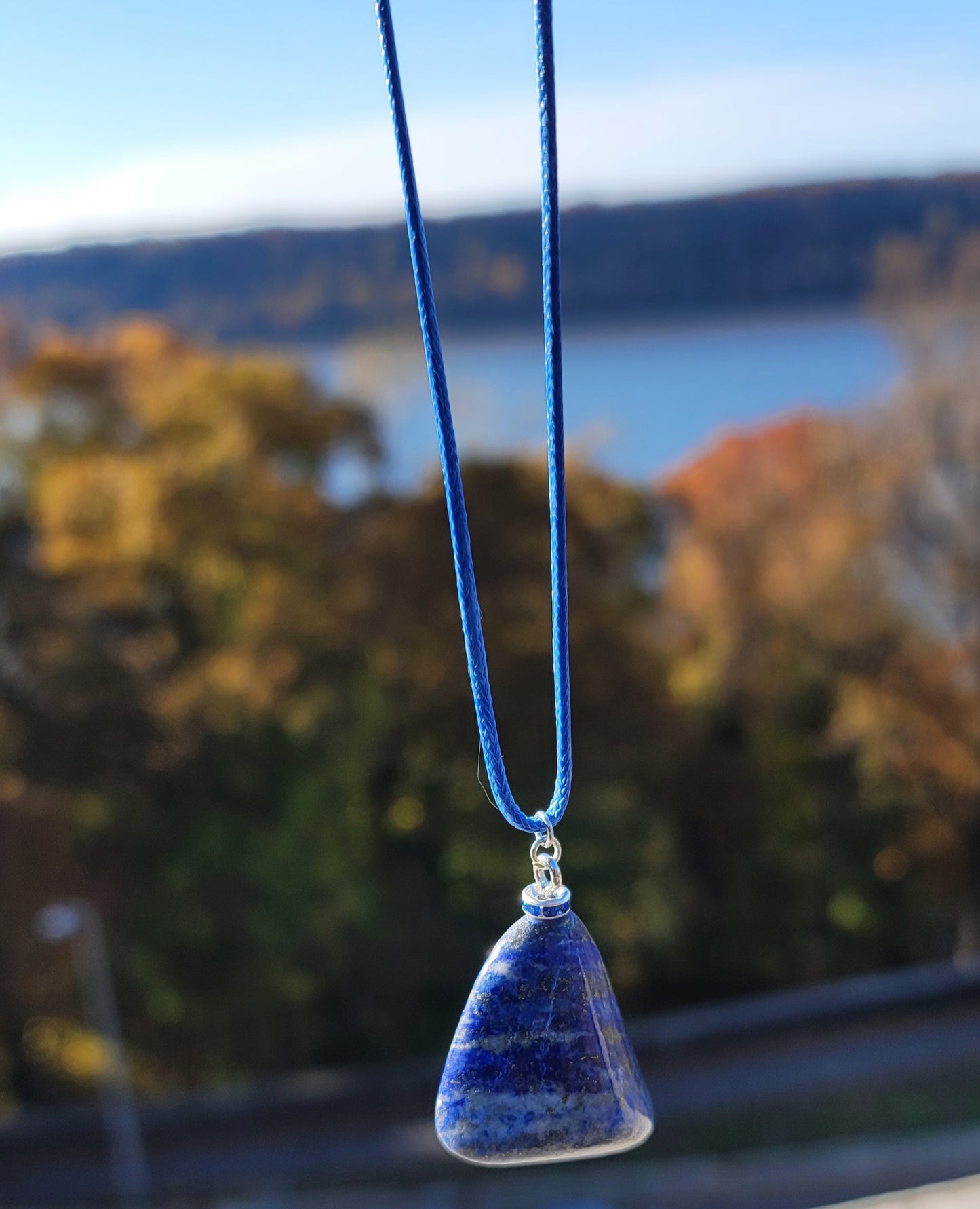 Uniquely shaped Blue Lapis lazuli Pendant necklace. Give this striking blue piece as a gift to that special person in your life. Great for mom or dad, Sis or brother. Perfect for any occasion or taste.