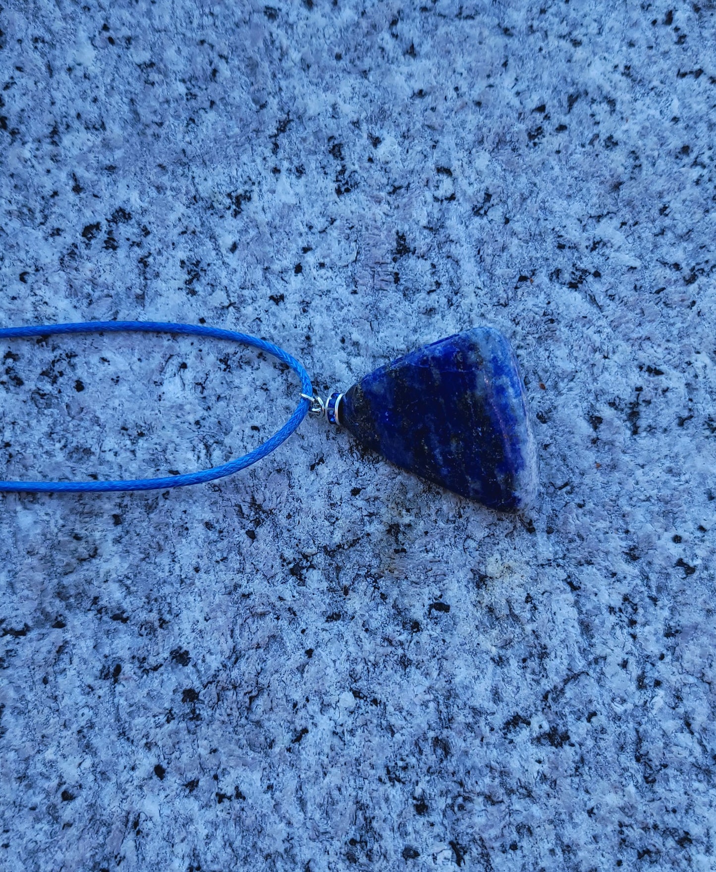 Uniquely shaped Blue Lapis lazuli Pendant necklace. Give this striking blue piece as a gift to that special person in your life. Great for mom or dad, Sis or brother. Perfect for any occasion or taste.