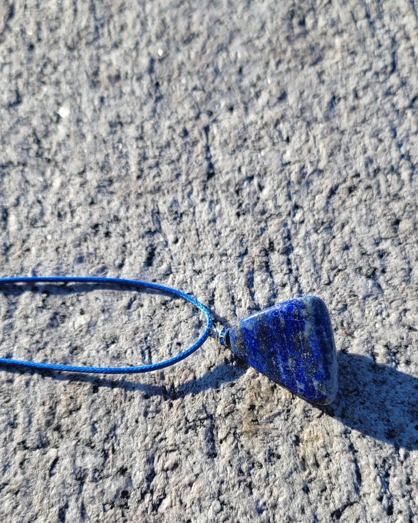 Uniquely shaped Blue Lapis lazuli Pendant necklace. Give this striking blue piece as a gift to that special person in your life. Great for mom or dad, Sis or brother. Perfect for any occasion or taste.