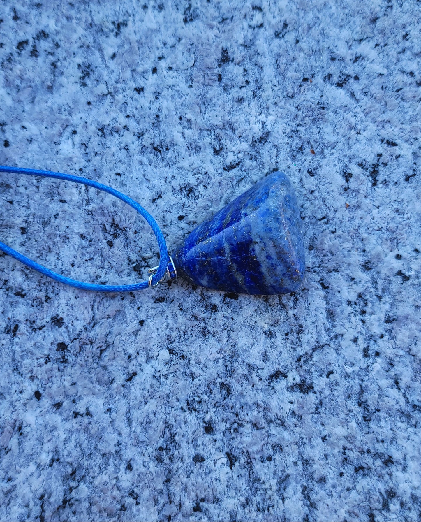 Uniquely shaped Blue Lapis lazuli Pendant necklace. Give this striking blue piece as a gift to that special person in your life. Great for mom or dad, Sis or brother. Perfect for any occasion or taste.