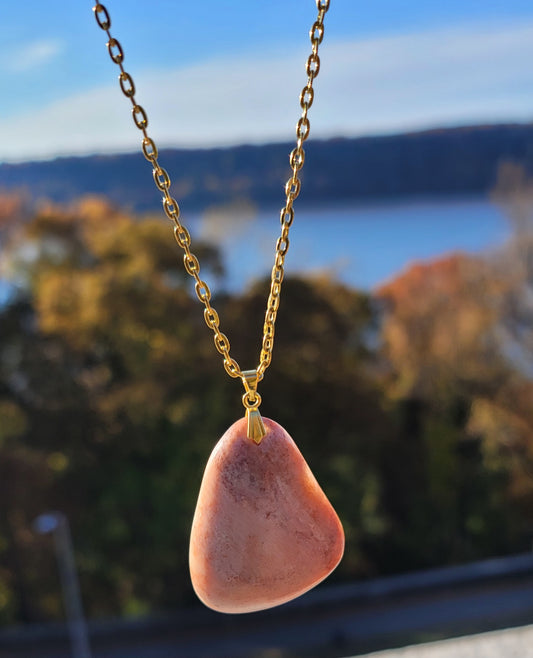 THIS ORANGE & PINK AVENTURINE PENDANT NECKLACE IS SURE TO DELIGHT WITH ITS UNIQUE SHAPE AND COLOR VARIATIONS.