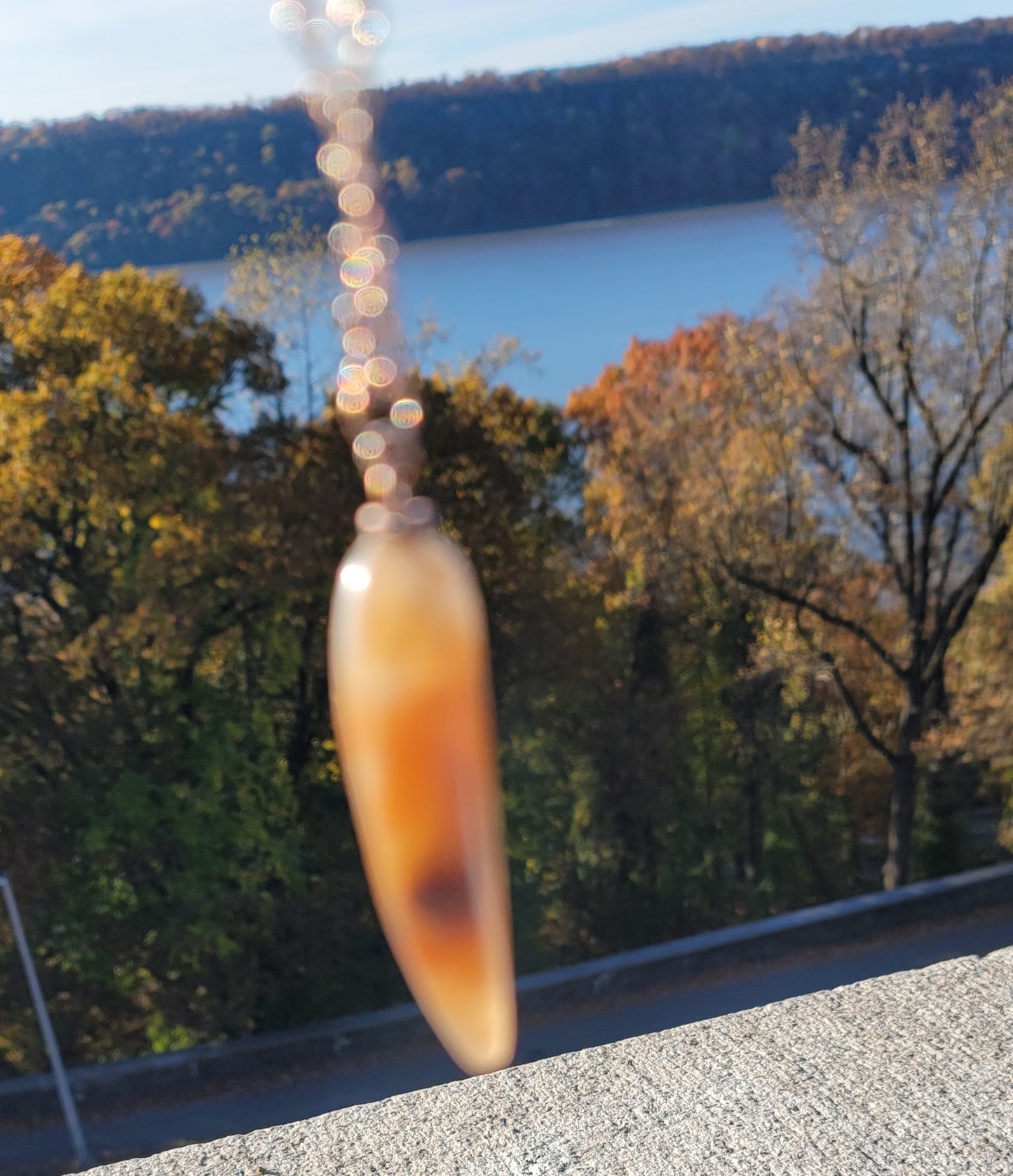 SLEEK FERRUGINOUS QUARTZ PENDANT.