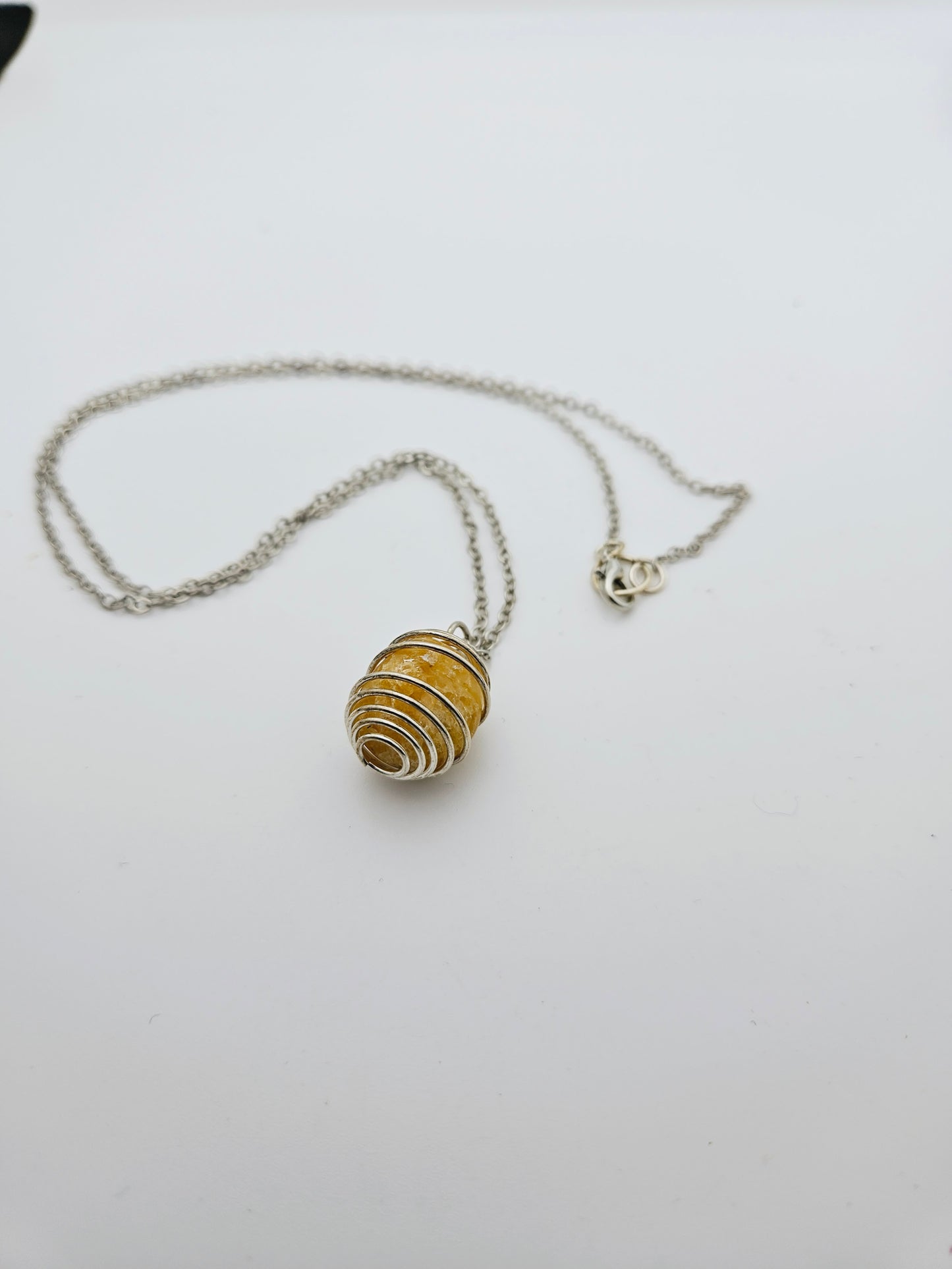 THIS IS A BEAUTIFUL GOLDEN QUARTZ SPIRAL CAGE NECKLACE