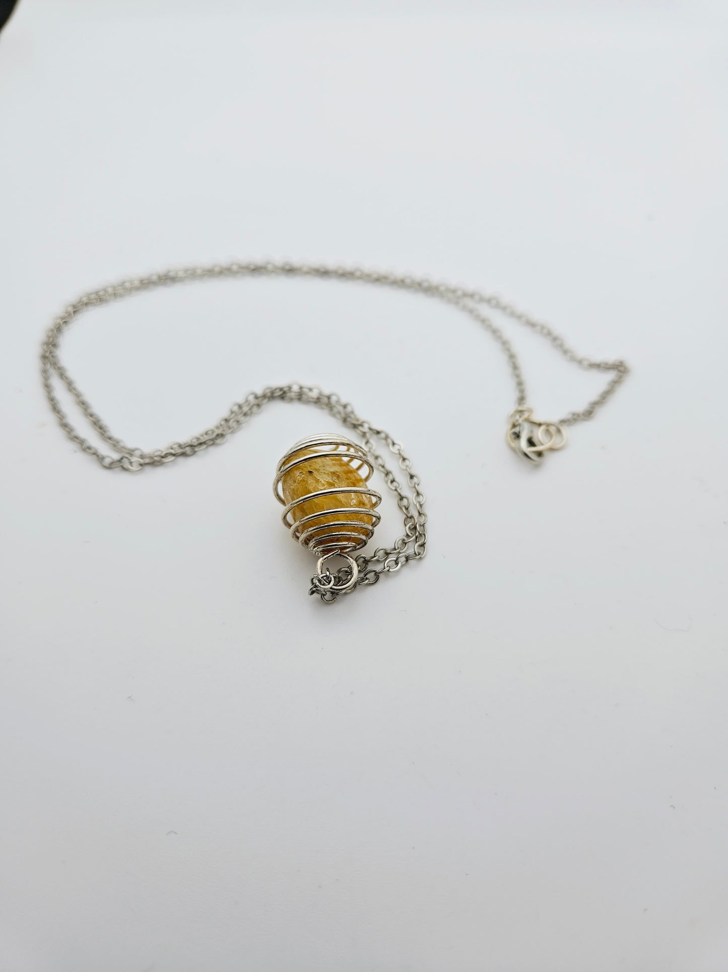 THIS IS A BEAUTIFUL GOLDEN QUARTZ SPIRAL CAGE NECKLACE