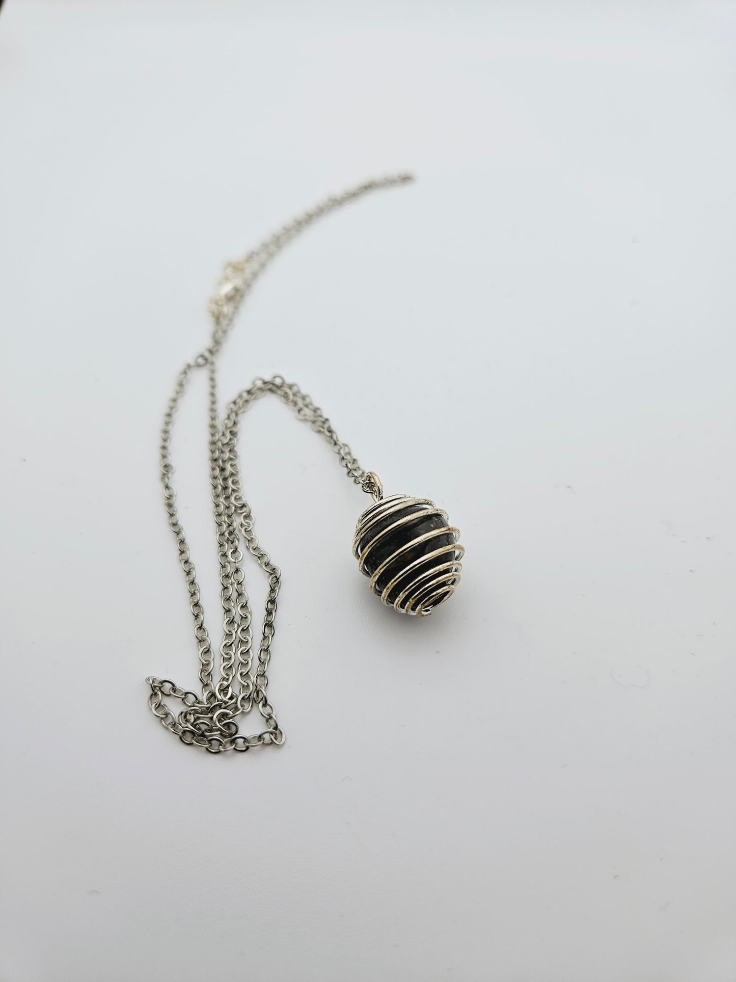 SIMPLY BEAUTIFUL BLACK AGATE NECKLACE IN SPIRAL CAGE