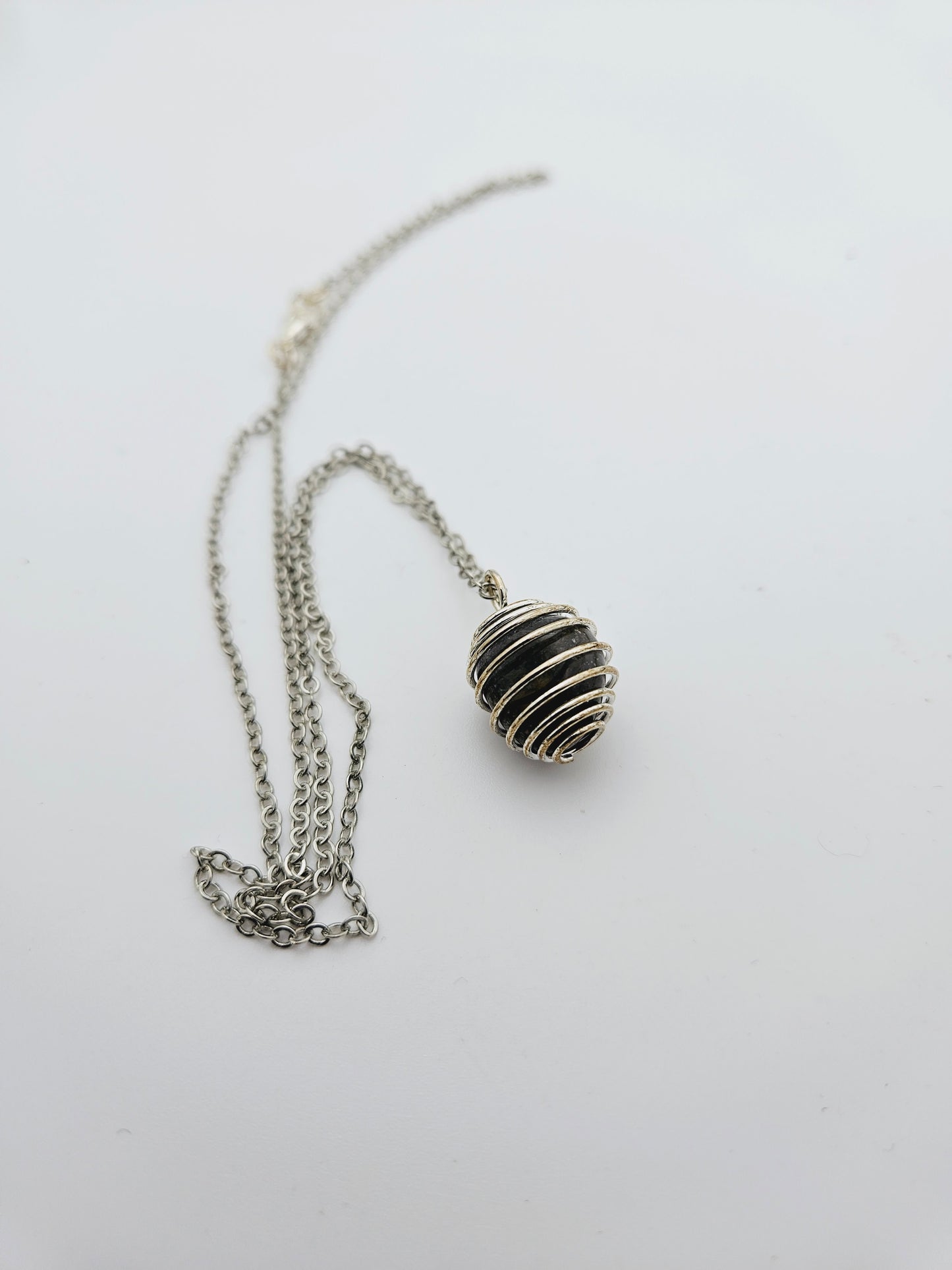 SIMPLY BEAUTIFUL BLACK AGATE NECKLACE IN SPIRAL CAGE