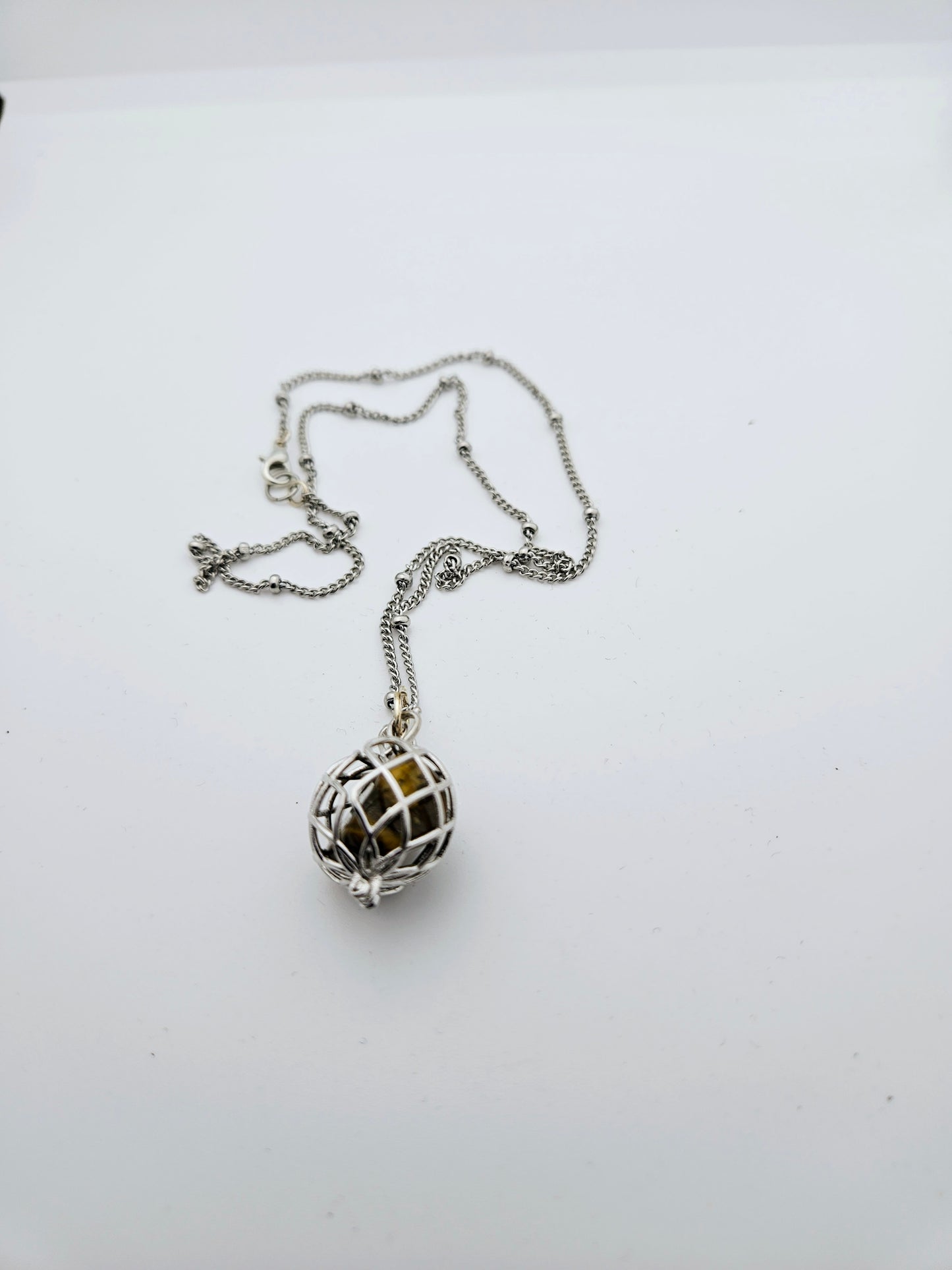 CAGED TIGER'S EYE PENDANT NECKLACE.