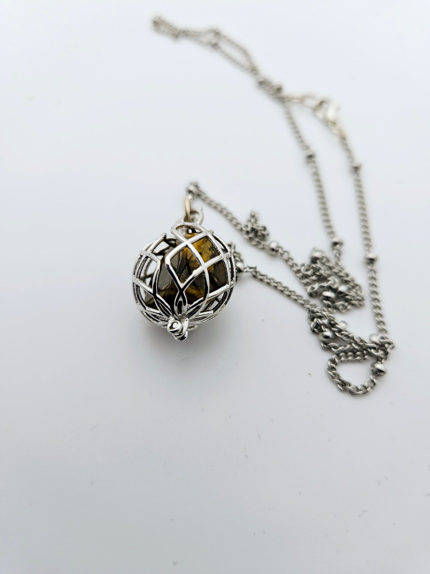 CAGED TIGER'S EYE PENDANT NECKLACE.