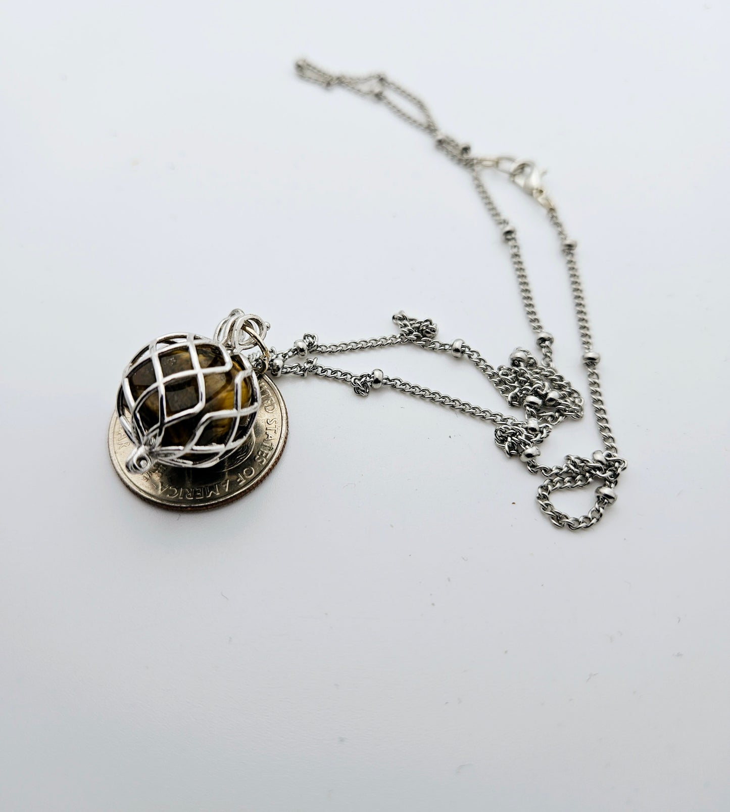 CAGED TIGER'S EYE PENDANT NECKLACE.