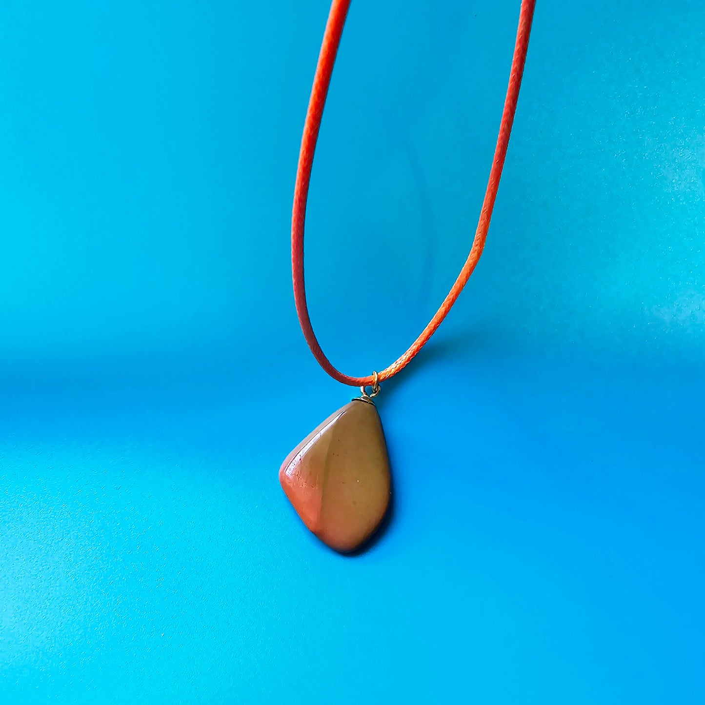 Beautiful Multi-colored Jasper Pendant, trimmed with gold-plated finding and an 18" Orange string.