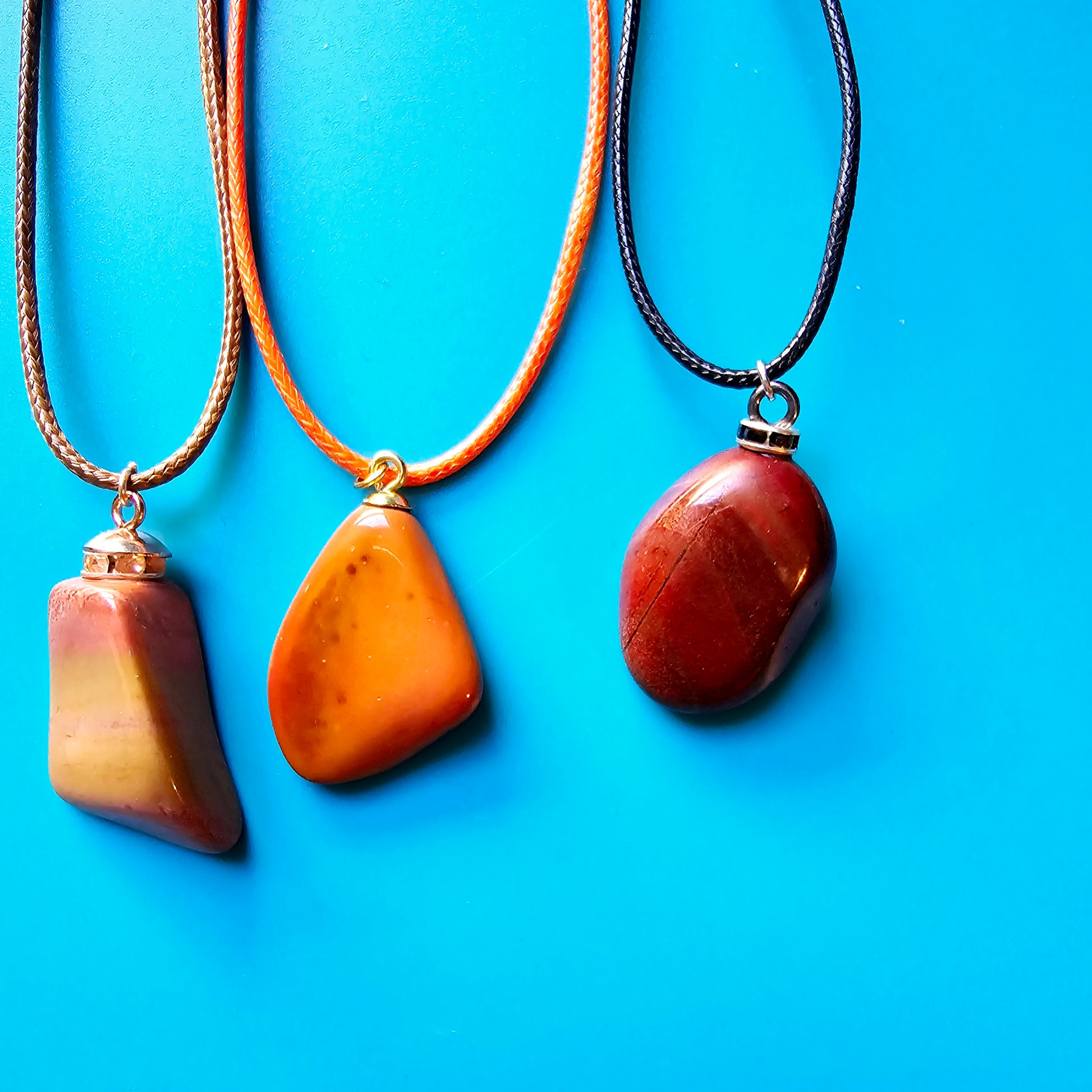 Beautiful Multi-colored Jasper Pendant, trimmed with gold-plated finding and an 18" Orange string. Paired with two other Jasper Pendants.