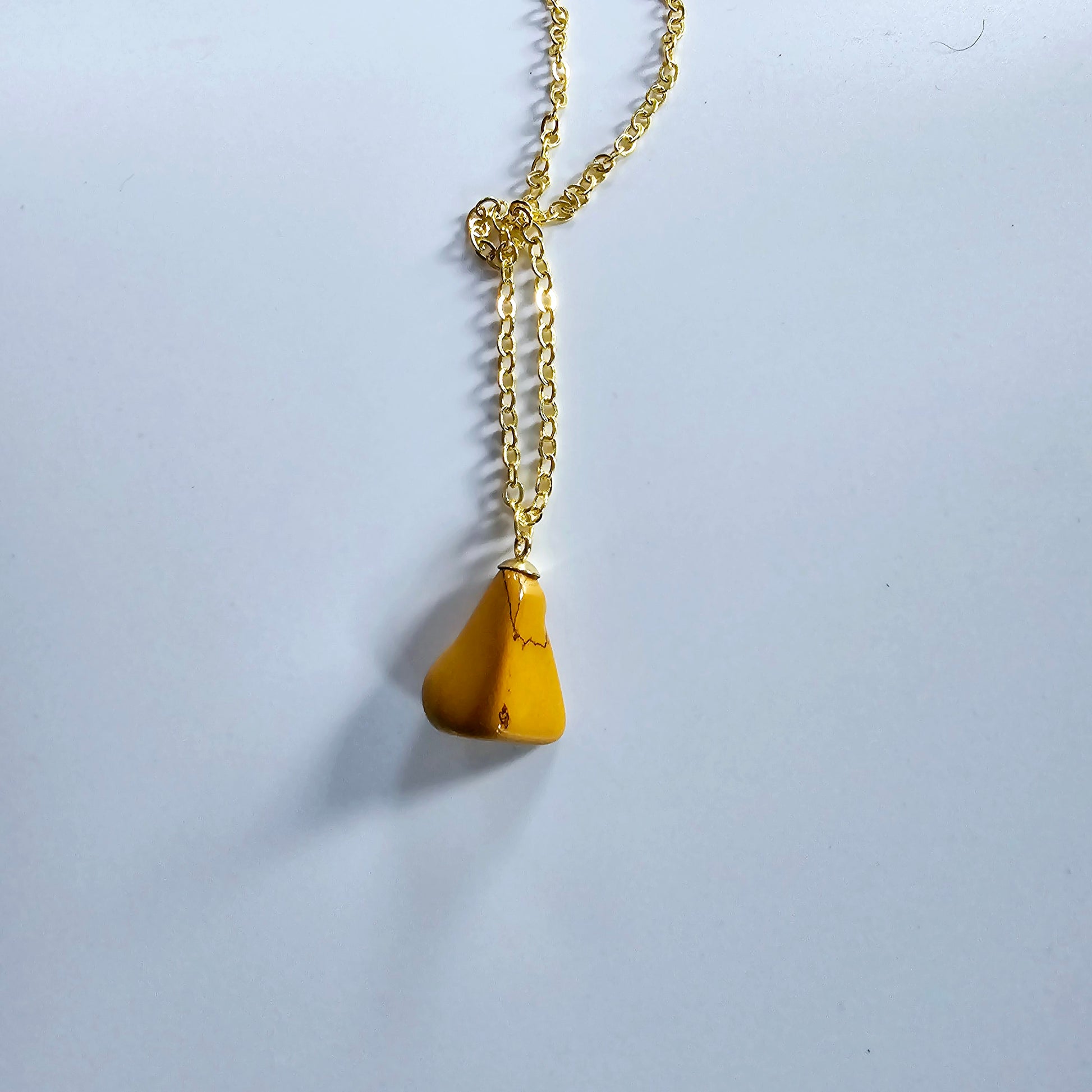 Uniquely shaped Yellow Jasper Pendant. This bold pendant is trimmed with gold-plated findings and gold-plated 20" chain