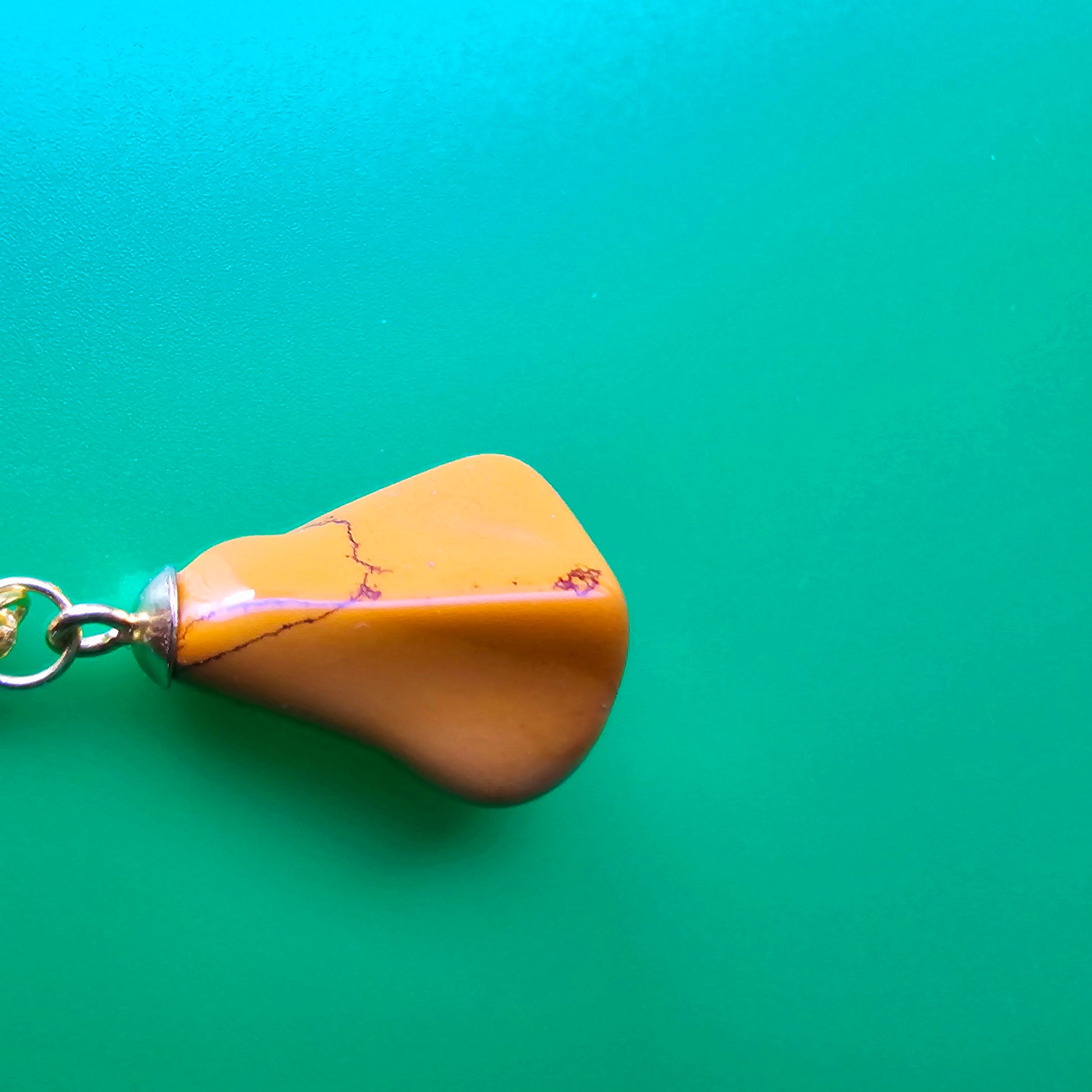 Uniquely shaped Yellow Jasper Pendant. This bold pendant is trimmed with gold-plated findings and gold-plated 20" chain