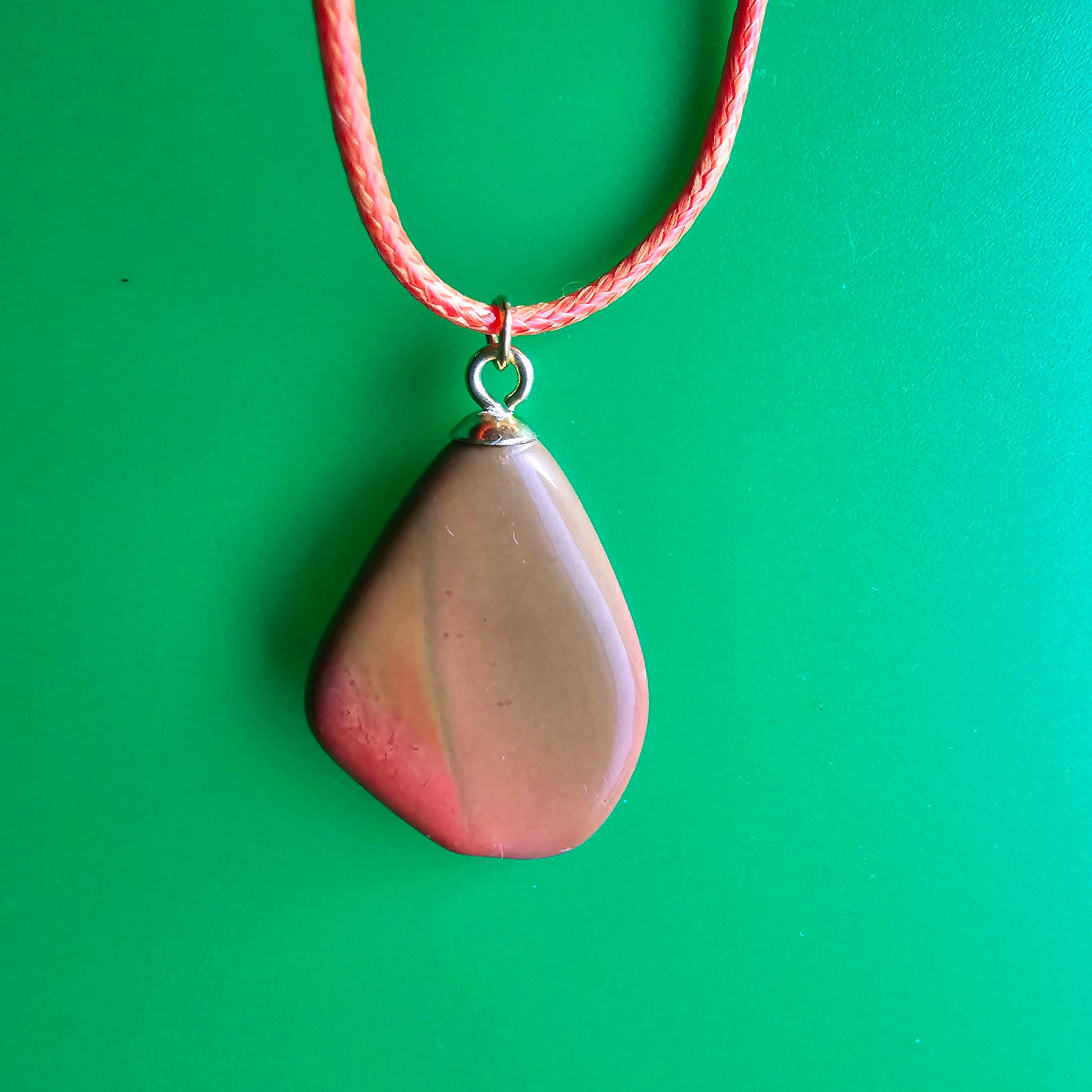 Beautiful Multi-colored Jasper Pendant, trimmed with gold-plated finding and an 18" Orange string.