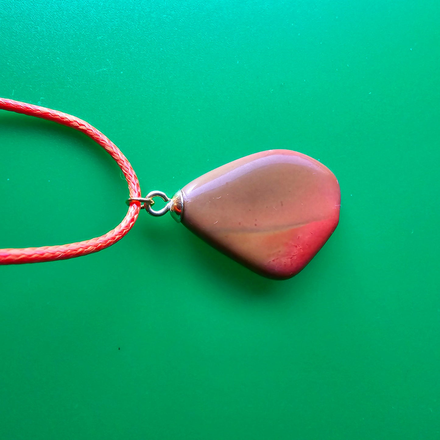 Beautiful Multi-colored Jasper Pendant, trimmed with gold-plated finding and an 18" Orange string.