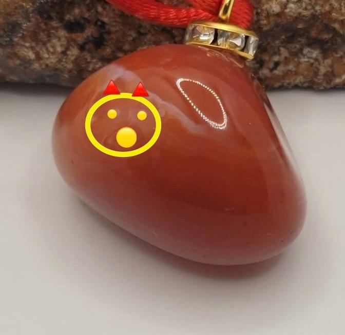 This is an intriguing and Beautiful Carnelian Agate Pendant. It is trimmed with a 20" Polyester string.