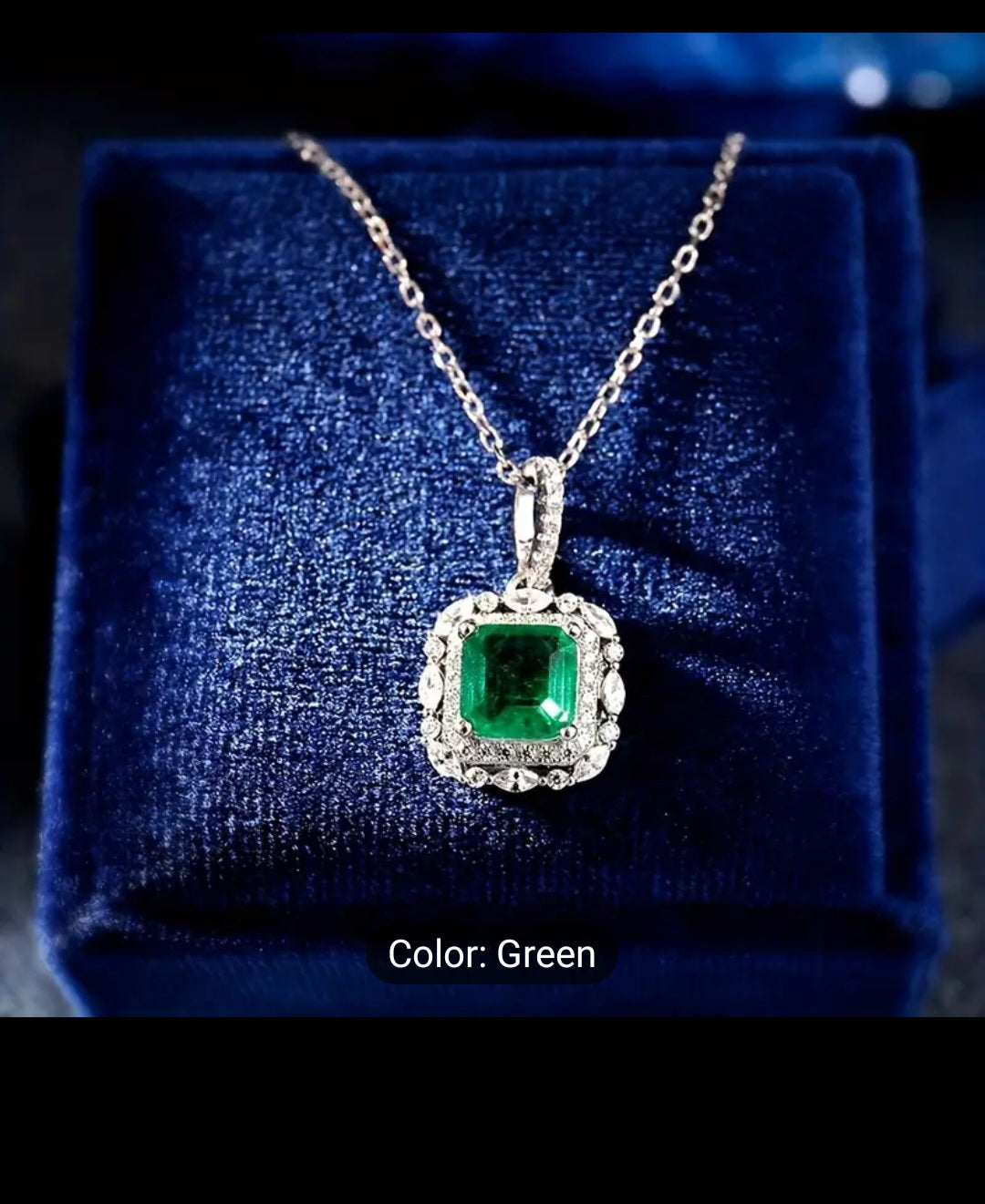 BEAUTIFUL SILVER-PLATED 4-CLAW EMERALD ZIRCON PENDANT.