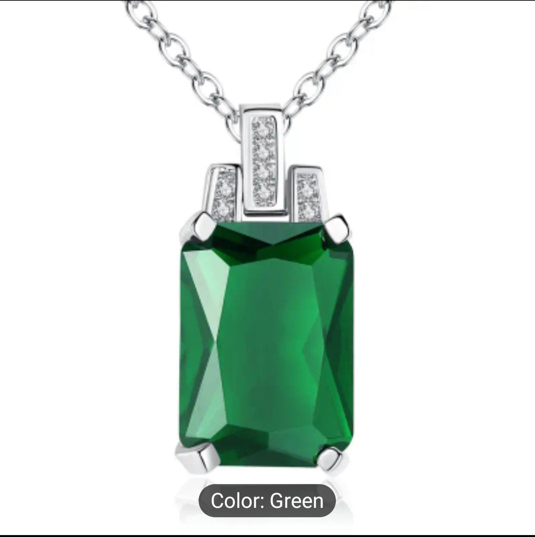 A Luxurious green baguette Zircon necklace that is trimmed all around with plated silver, including a plated silver chain. This is a fashion piece that is stylish and affordable. A perfect gift for her.