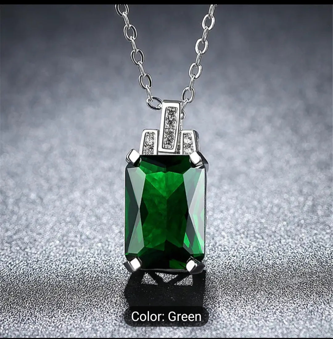 A Luxurious green baguette Zircon necklace that is trimmed all around with plated silver, including a plated silver chain. This is a fashion piece that is stylish and affordable. A perfect gift for her.