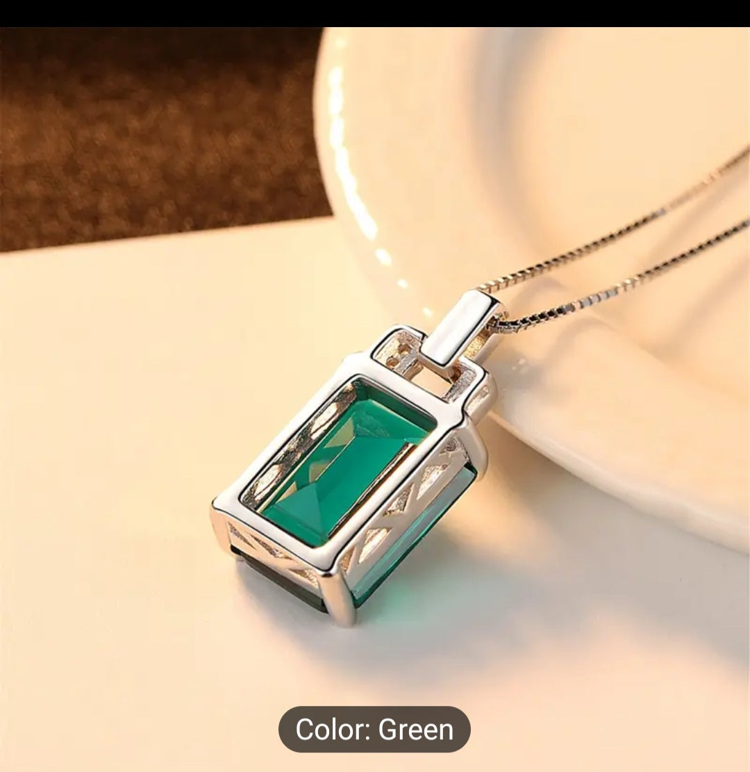 A Luxurious green baguette Zircon necklace that is trimmed all around with plated silver, including a plated silver chain. This is a fashion piece that is stylish and affordable. A perfect gift for her.