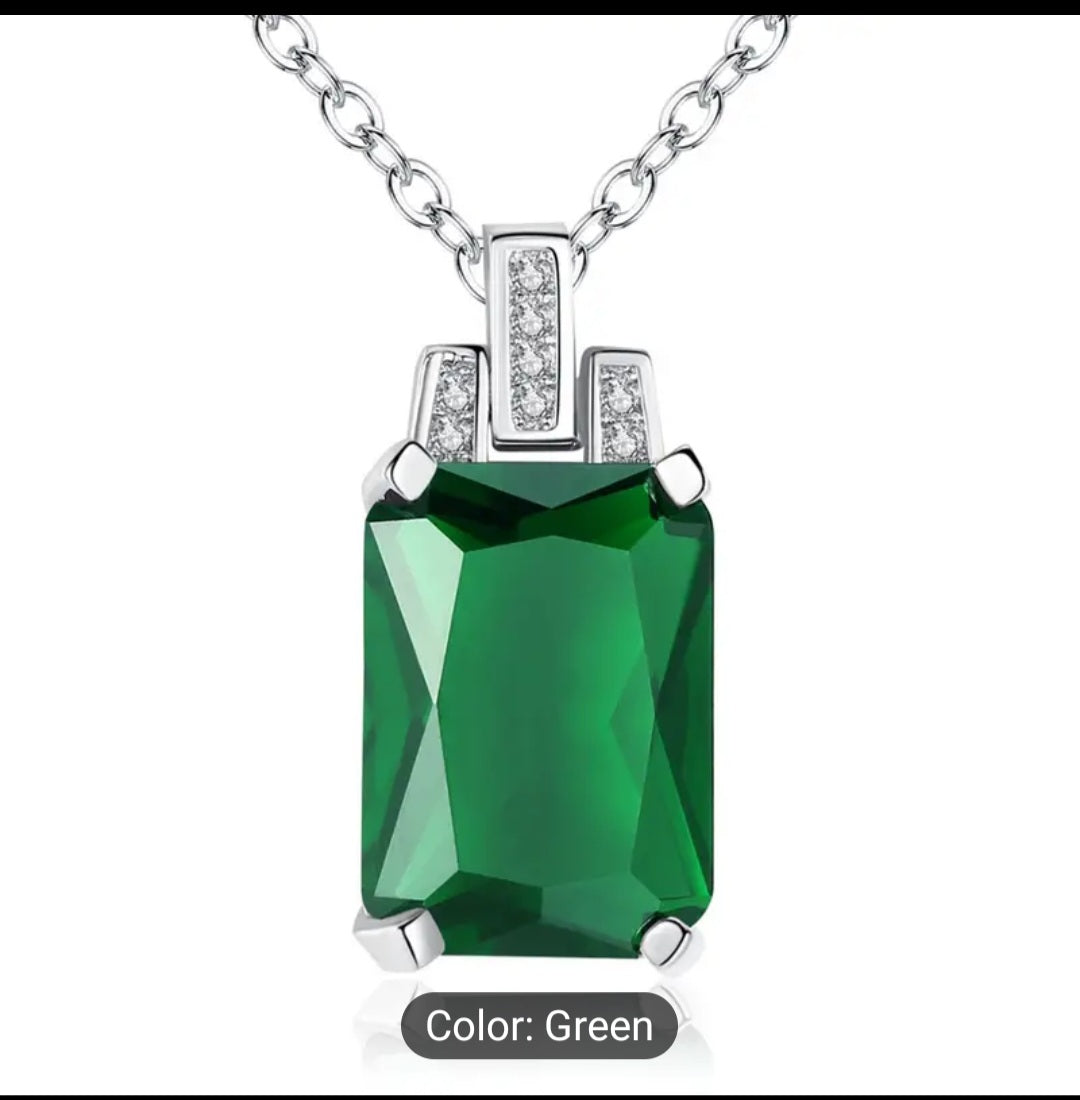 A Luxurious green baguette Zircon necklace that is trimmed all around with plated silver, including a plated silver chain. This is a fashion piece that is stylish and affordable. A perfect gift for her.