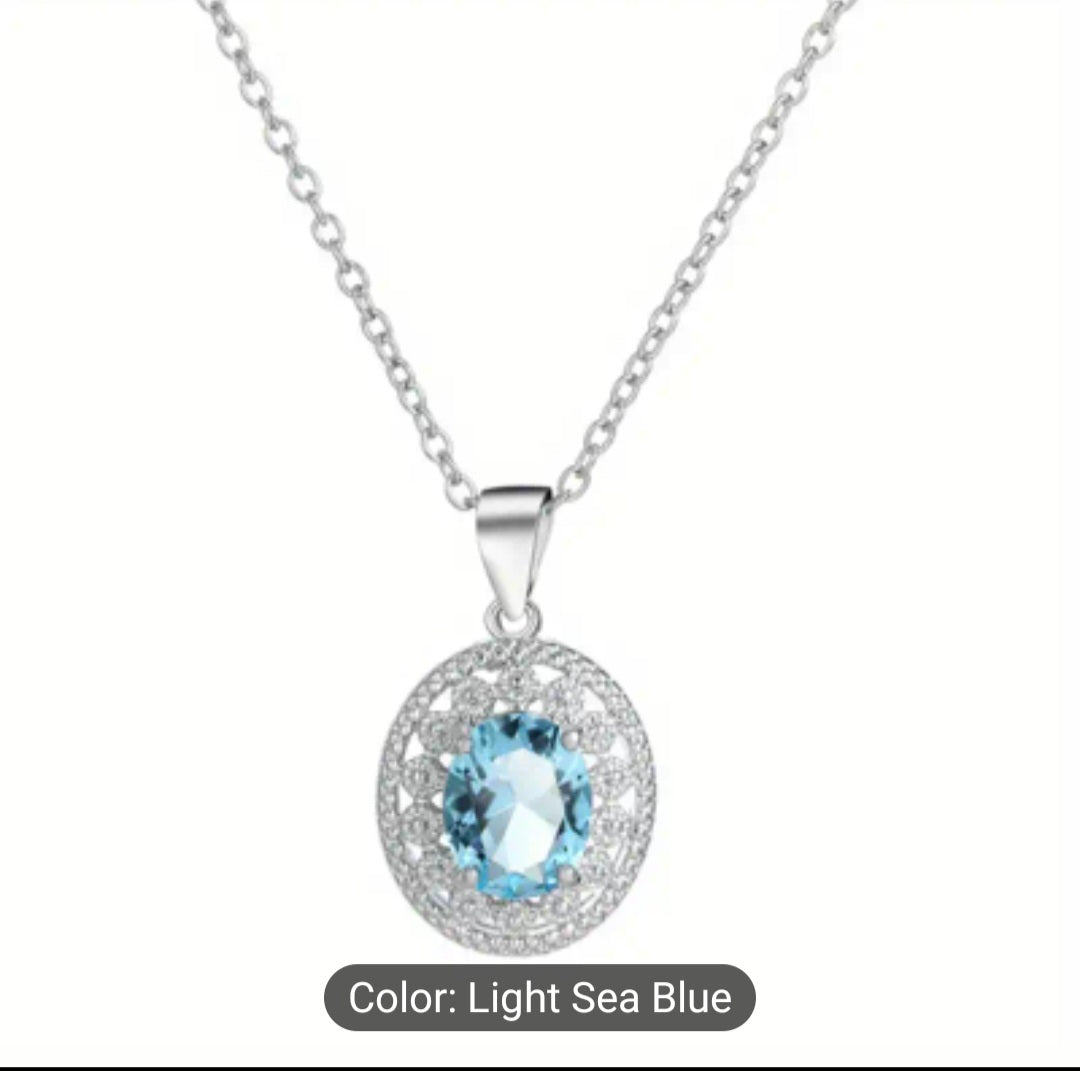 Elegant stainless steel necklace adorned with blue topaz. Perfect for any occasion or as a lovely gift for that special person.