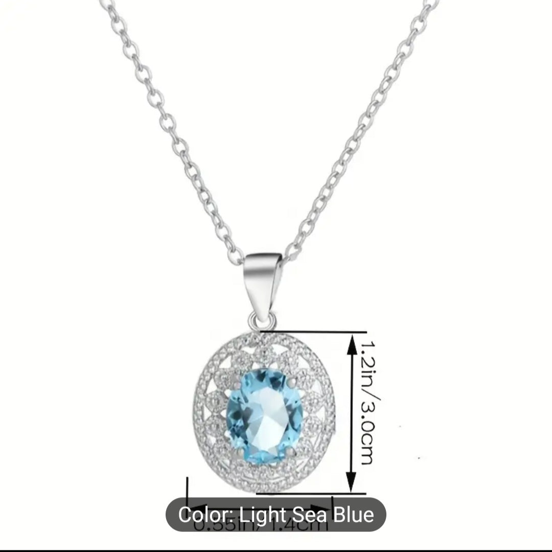 Elegant stainless steel necklace adorned with blue topaz. Perfect for any occasion or as a lovely gift for that special person.