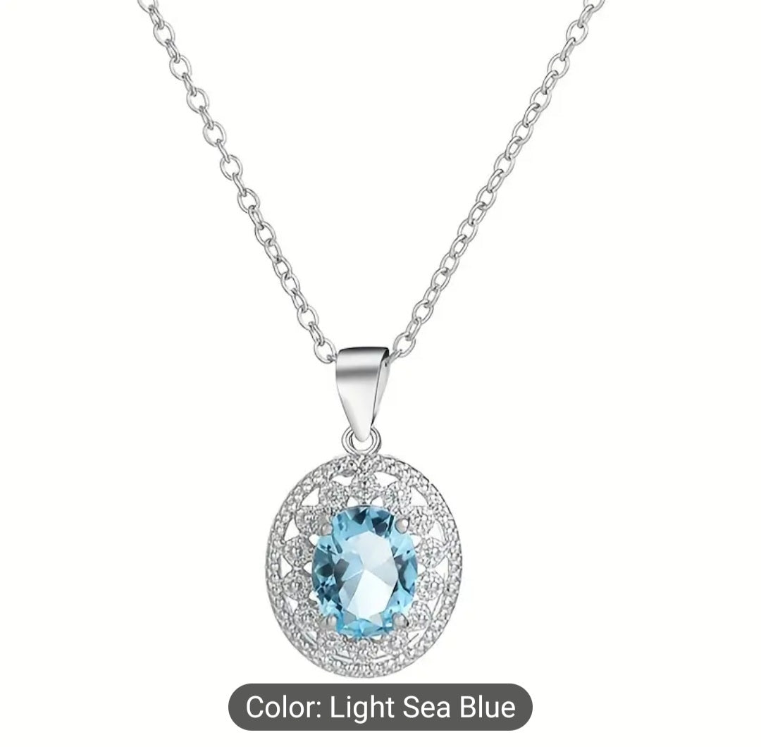 Elegant stainless steel necklace adorned with blue topaz. Perfect for any occasion or as a lovely gift for that special person.