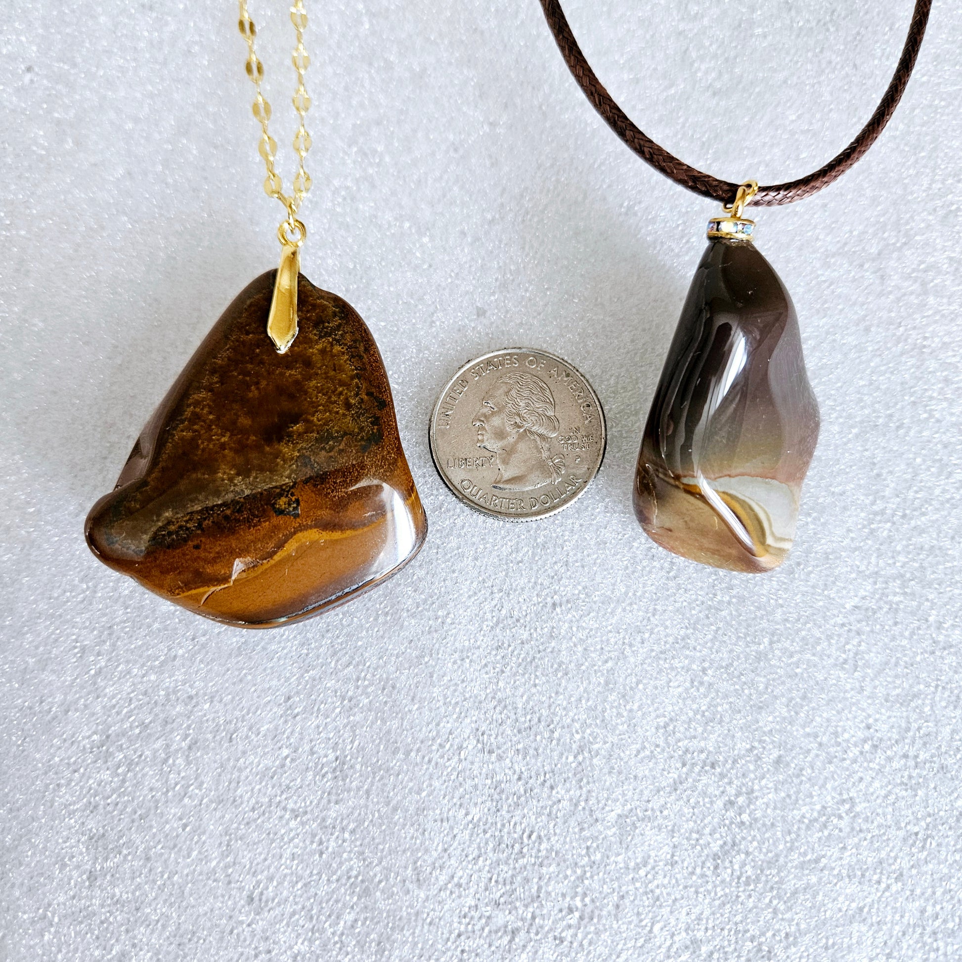 This bold desert jasper pendant is expertly crafted from stunning, natural jasper stone. Its unique, bold design exudes confidence and style, making it the perfect statement piece for any outfit