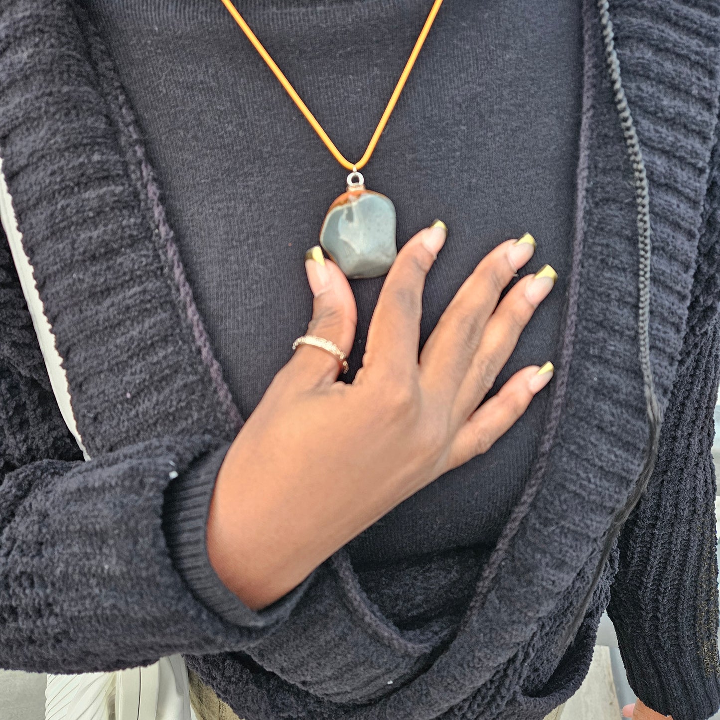 Unique and bold Desert Jasper Pendant with a very intricate color pattern. You will be amazed by its stunning beauty. It is finished with a Yellow Polyester string.