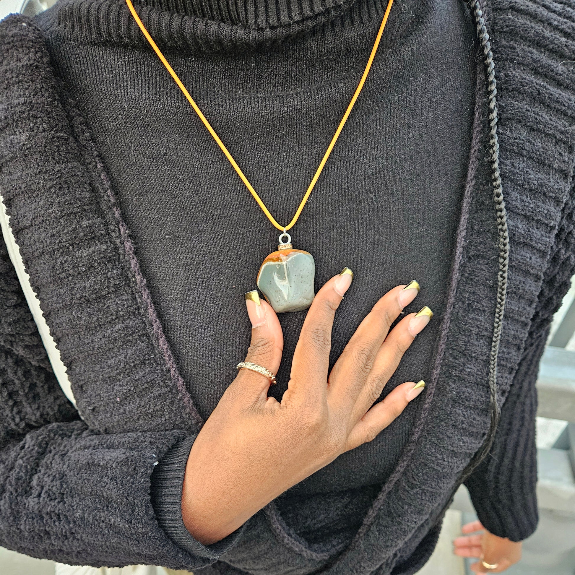 Unique and bold Desert Jasper Pendant with a very intricate color pattern. You will be amazed by its stunning beauty. It is finished with a Yellow Polyester string.