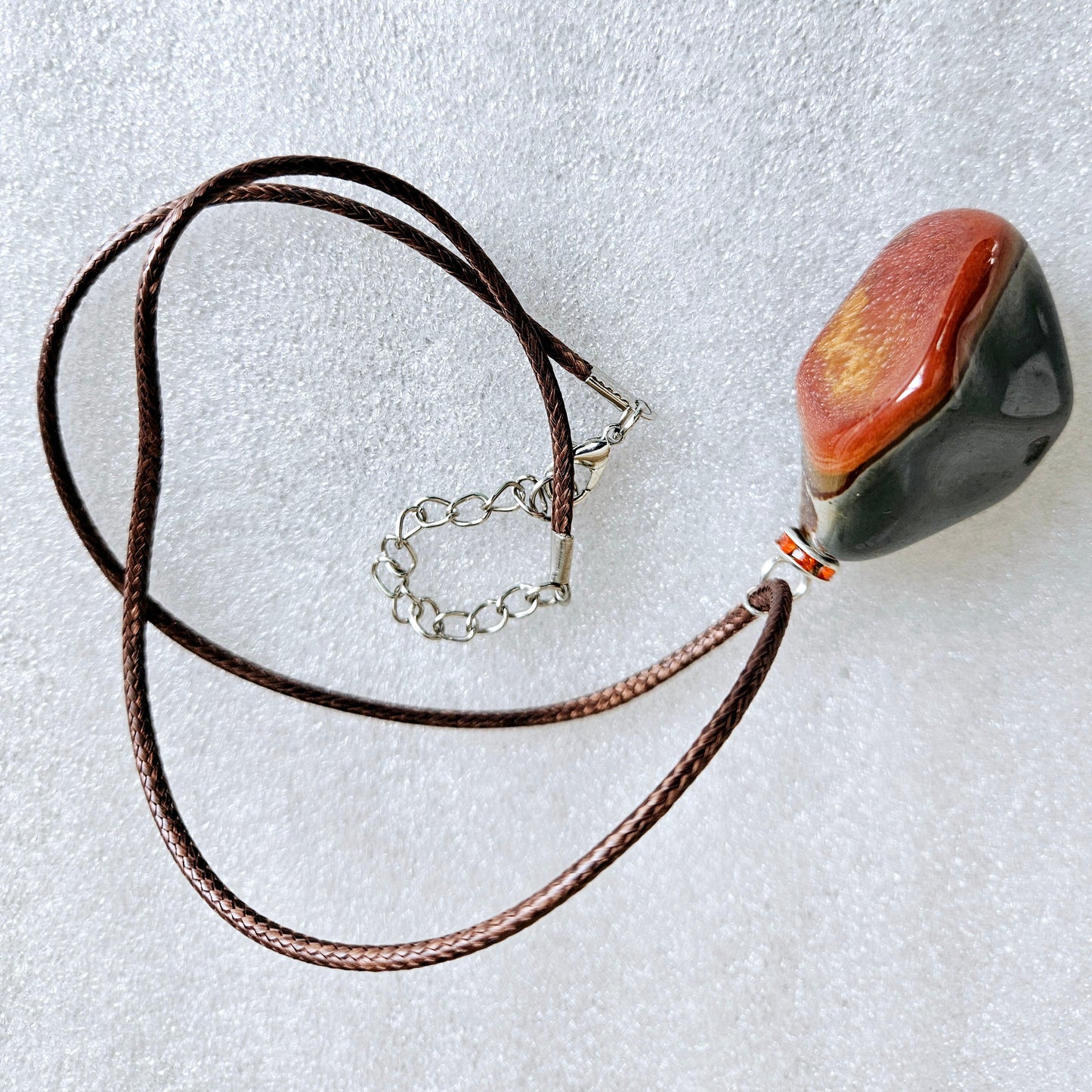 BEAUTIFUL POLYCHROME JASPER PENDANT WITH A STUNNING ARRAY OF COLOR PATTERNS.