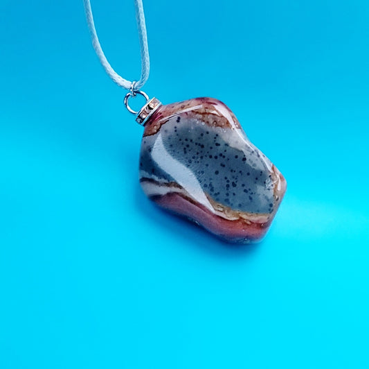 AMAZING DESERT JASPER PENDANT with extremely intricate color patterns and details! This is a very intricate and mesmerizing piece, featuring amazing color patterns and design. The shape is also super unique and will definitely stand out in the crowd!