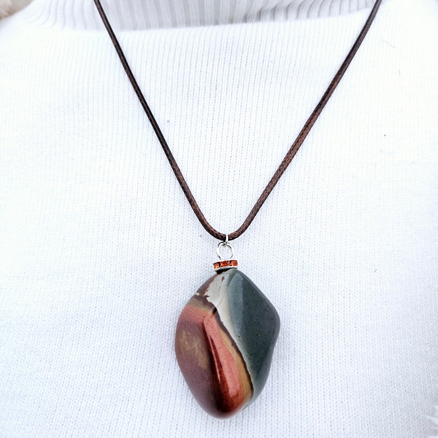 BEAUTIFUL POLYCHROME JASPER PENDANT WITH A STUNNING ARRAY OF COLOR PATTERNS.