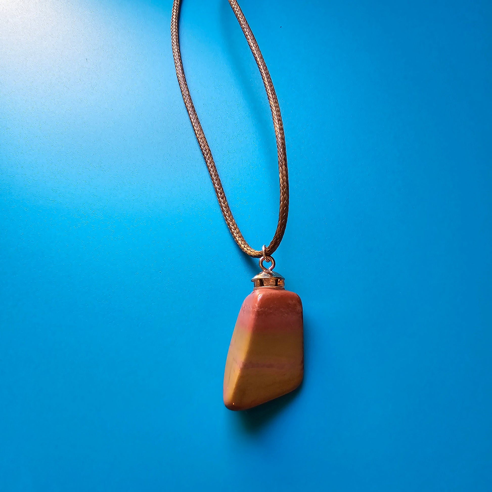 Very vibrant and colorful Jasper pendant that's trimmed with copper findings and an 18" Polyester string.