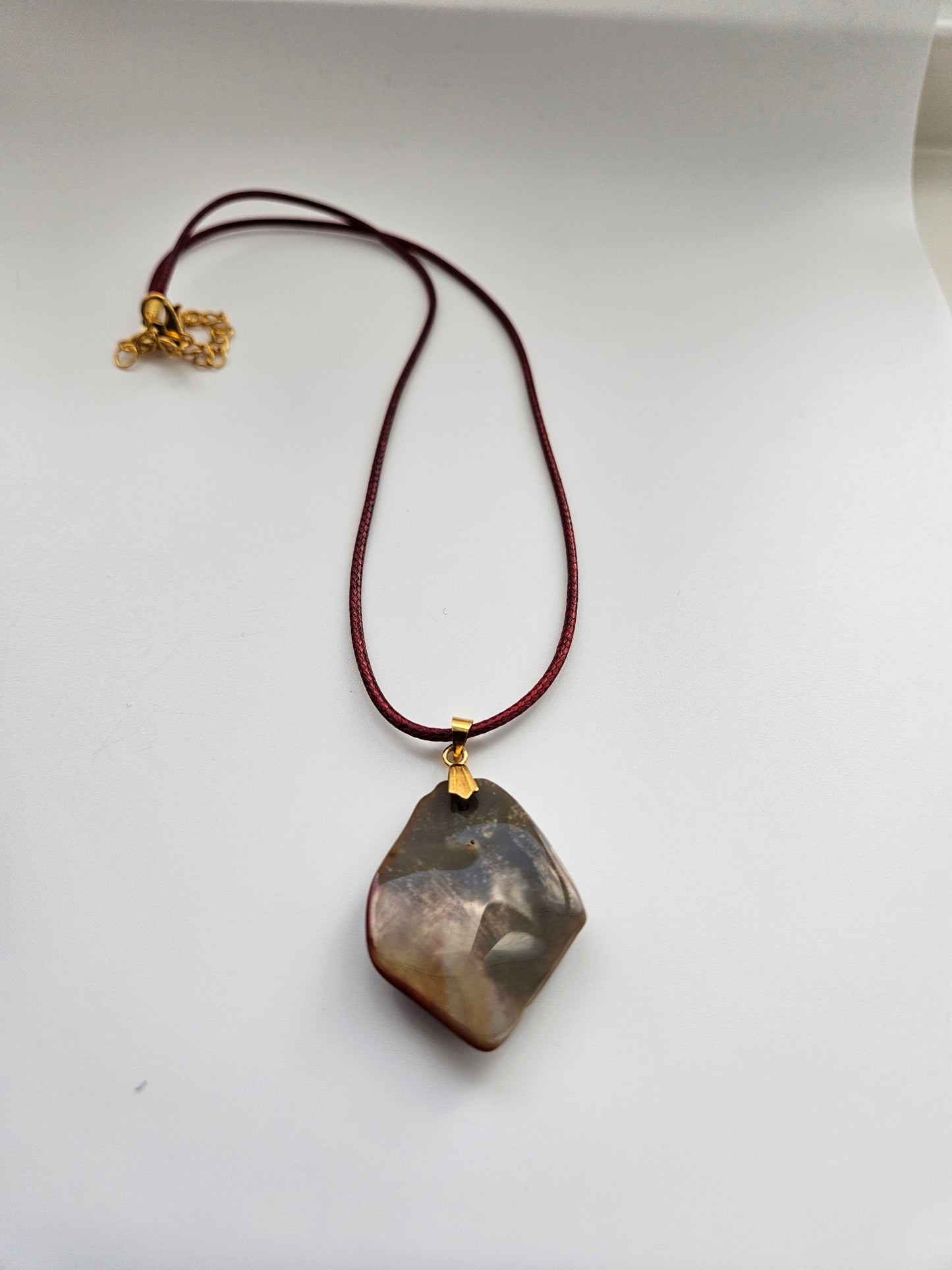 AN EXQUISITE DESERT JASPER PENDANT that is super unique in shape and color. Be amazed by the Uniqueness of this Pendant. You are sure to be the center of the conversation with this piece!!