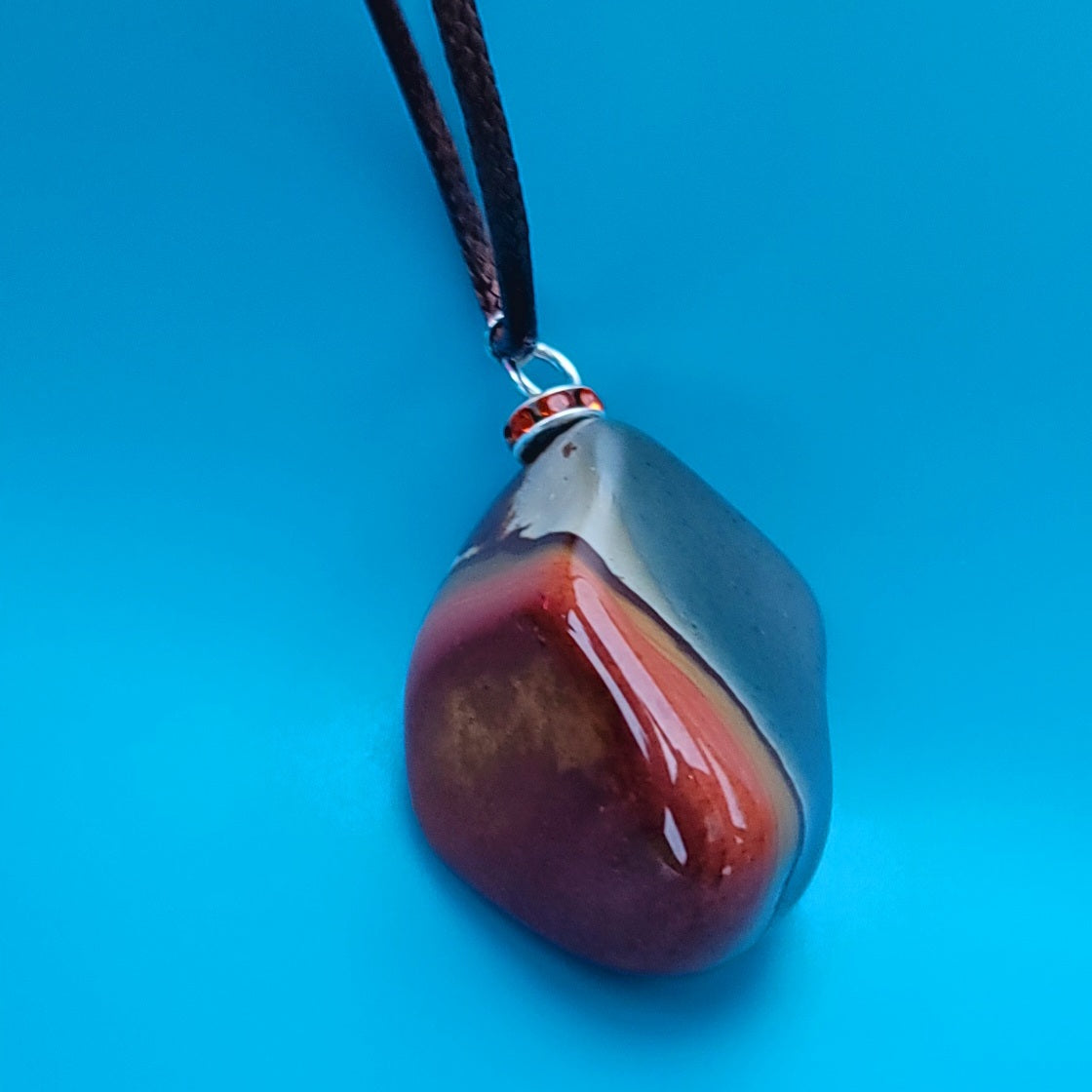 BEAUTIFUL POLYCHROME JASPER PENDANT WITH A STUNNING ARRAY OF COLOR PATTERNS.