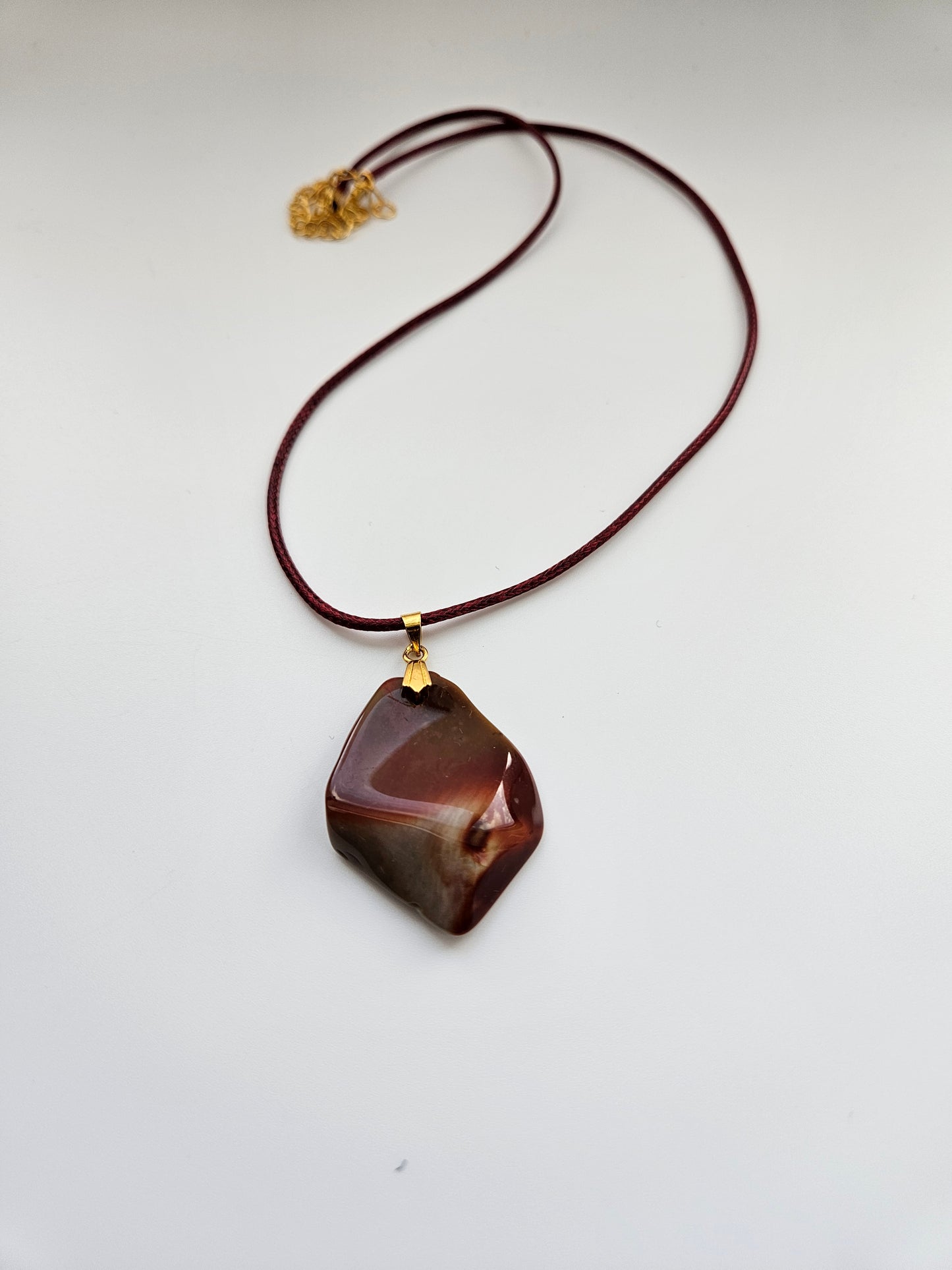 AN EXQUISITE DESERT JASPER PENDANT that is super unique in shape and color. Be amazed by the Uniqueness of this Pendant. You are sure to be the center of the conversation with this piece!!