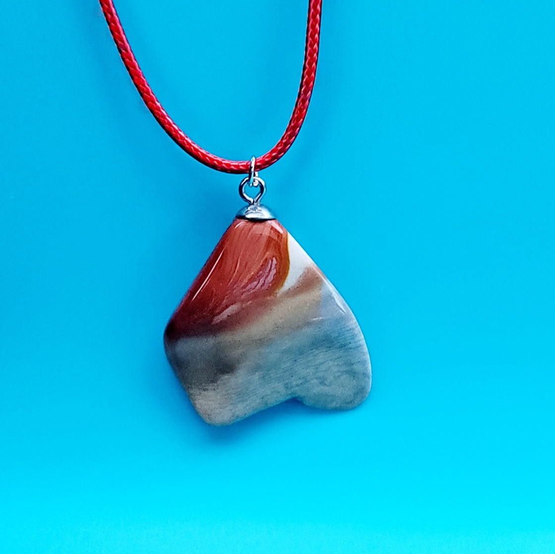 A Desert Jasper Pendant with an intricate color pattern that is sure to entice you! This is such a unique and interesting Pendant that it is sure to entice you! Explore its details and features and enjoy!!