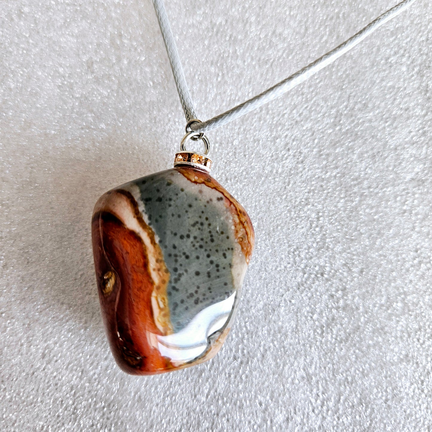 AMAZING DESERT JASPER PENDANT with extremely intricate color patterns and details! This is a very intricate and mesmerizing piece, featuring amazing color patterns and design. The shape is also super unique and will definitely stand out in the crowd!