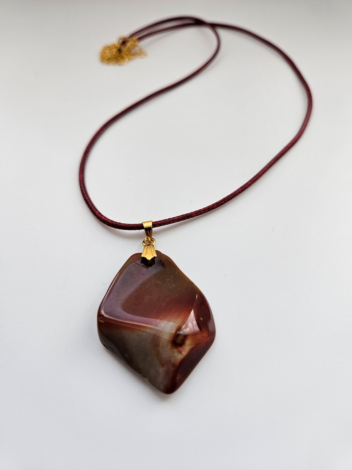 AN EXQUISITE DESERT JASPER PENDANT that is super unique in shape and color. Be amazed by the Uniqueness of this Pendant. You are sure to be the center of the conversation with this piece!!