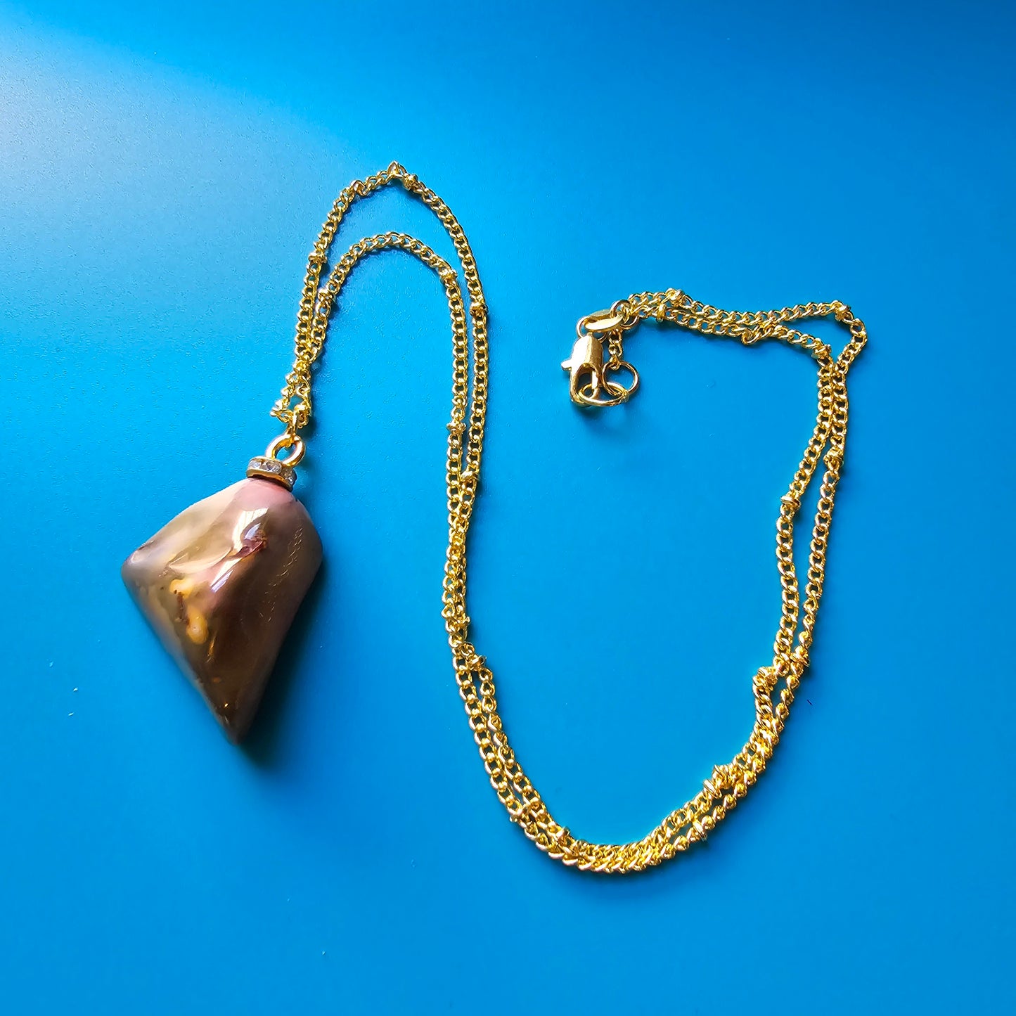 Beautiful Desert Jasper Pendant, trimmed with gold-plated findings and unique gold-plated 20" chain.