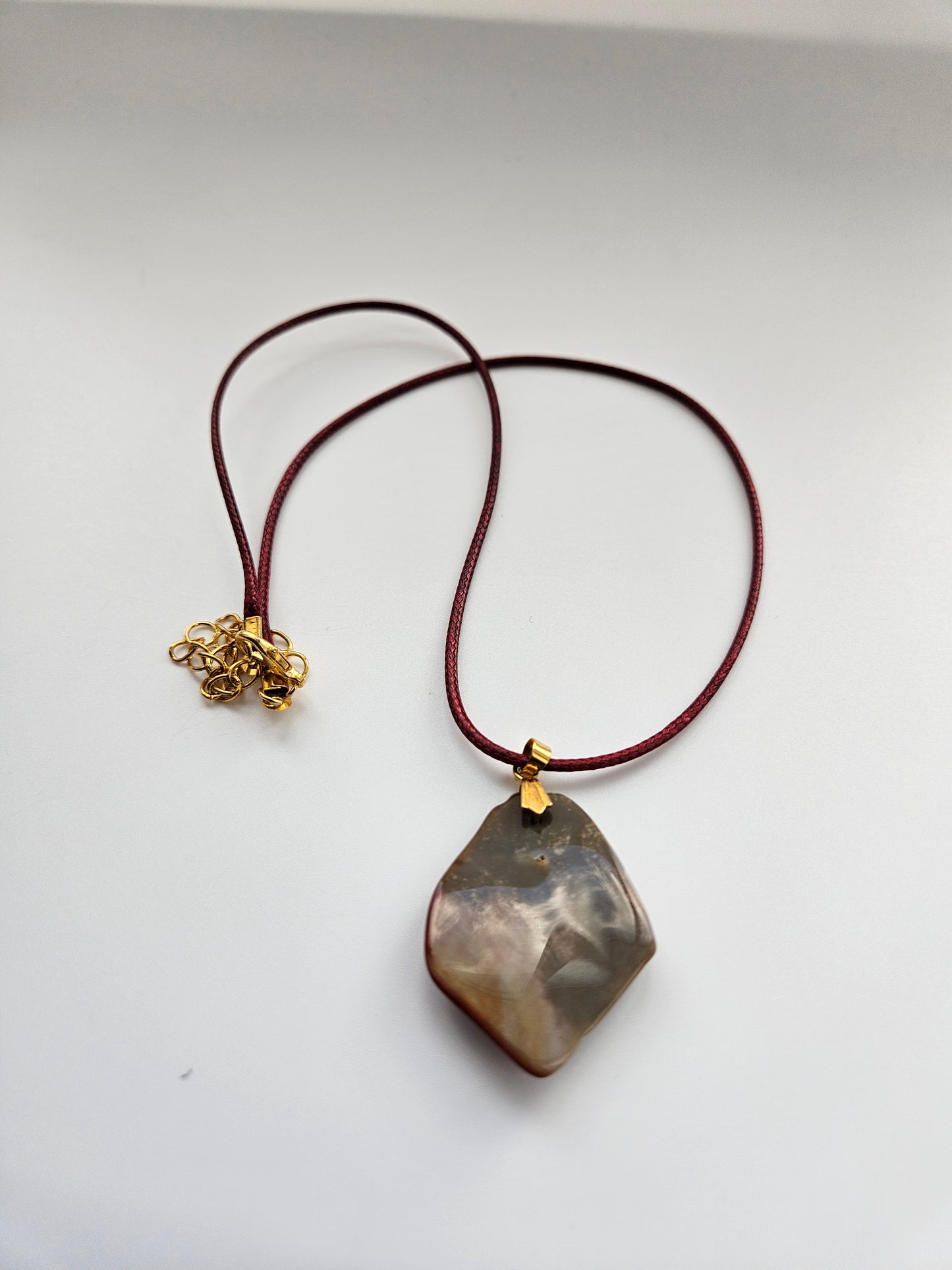 AN EXQUISITE DESERT JASPER PENDANT that is super unique in shape and color. Be amazed by the Uniqueness of this Pendant. You are sure to be the center of the conversation with this piece!!