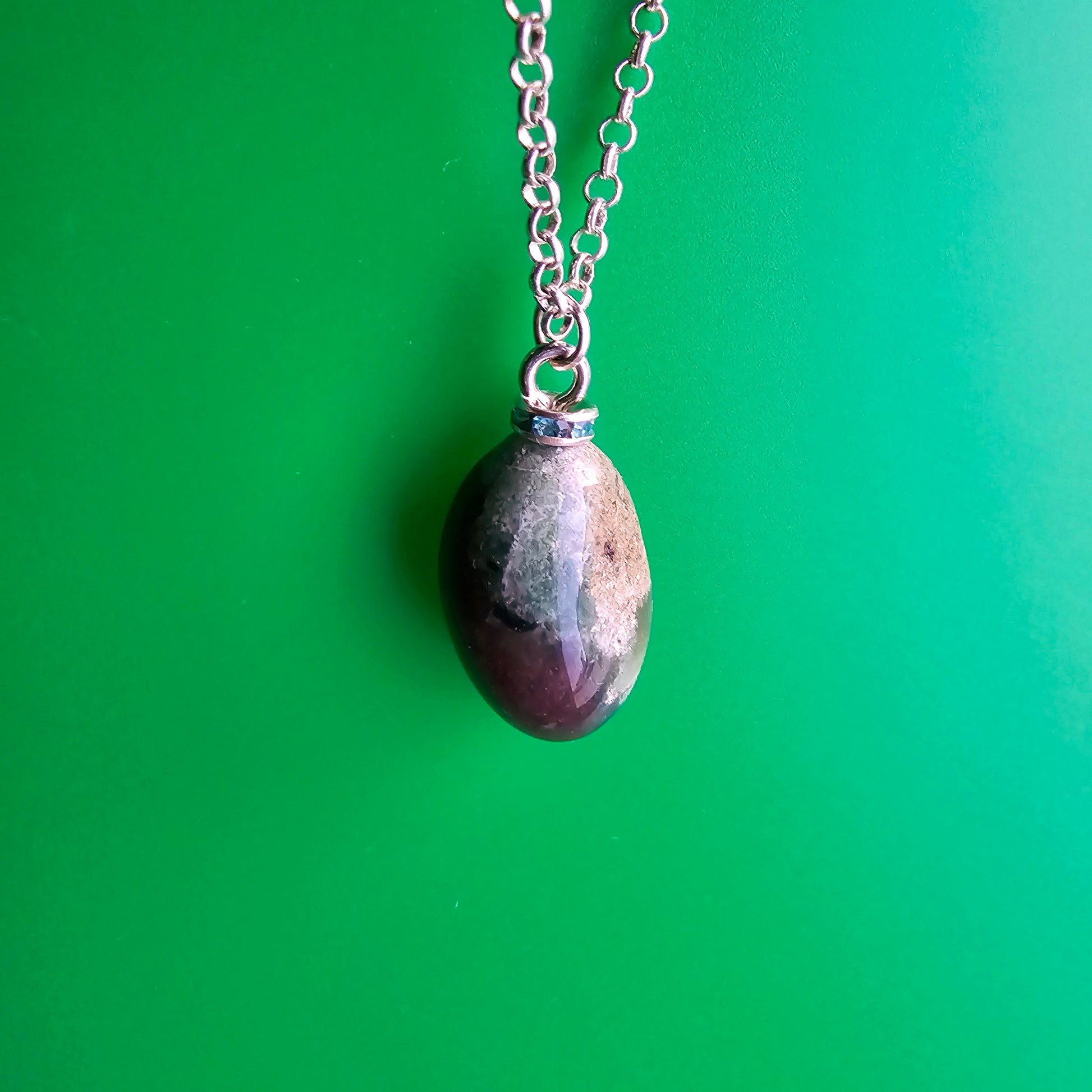 Beautiful, multicolored green Jasper Pendant. This pendant has very unique color patterns which makes it one of a kind.